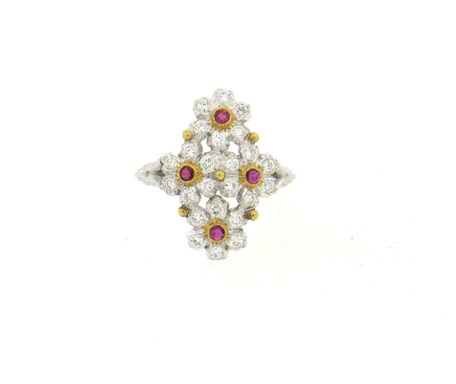 Delicate 18k white and yellow gold flower ring, crafted by Buccellati, featuring 0.48ctw in H/VS diamonds and 0.25ctw in rubies. Ring size 6.75; ring top is 21mm x 15mm. Marked: Buccellati Italy, 18k, 750,L0659. Weight of the piece - 3.88 grams