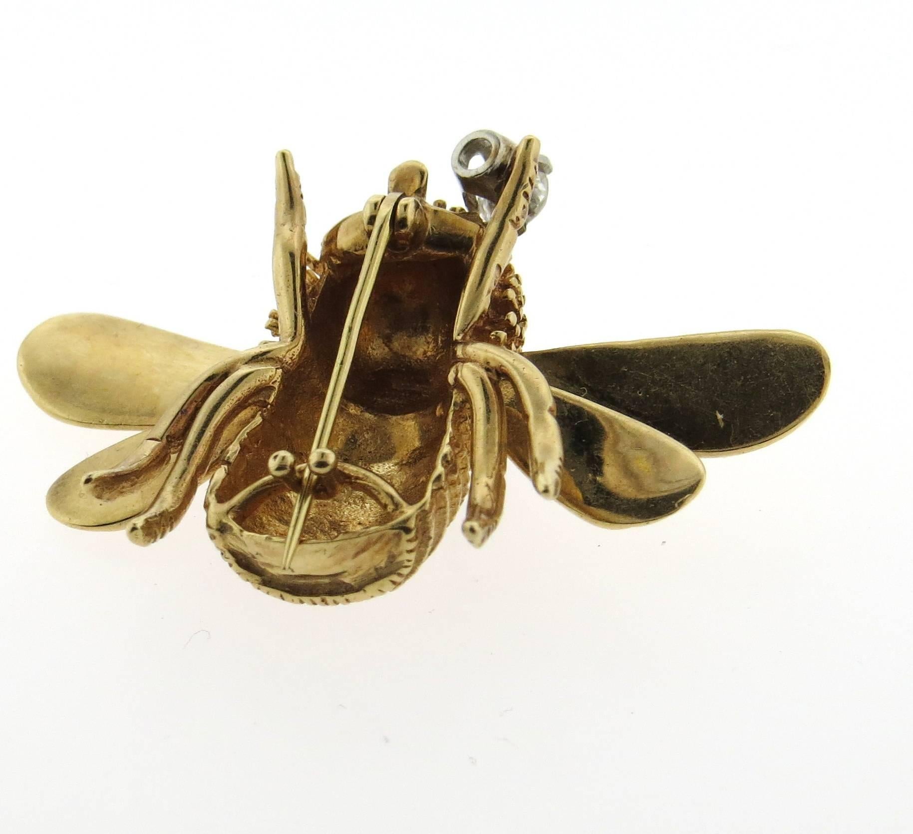 A 14k yellow gold bee brooch set with an H/VS diamond weighing approximately 0.23ct. The brooch measures 29mm x 43mm and weighs 13.2 grams. 
