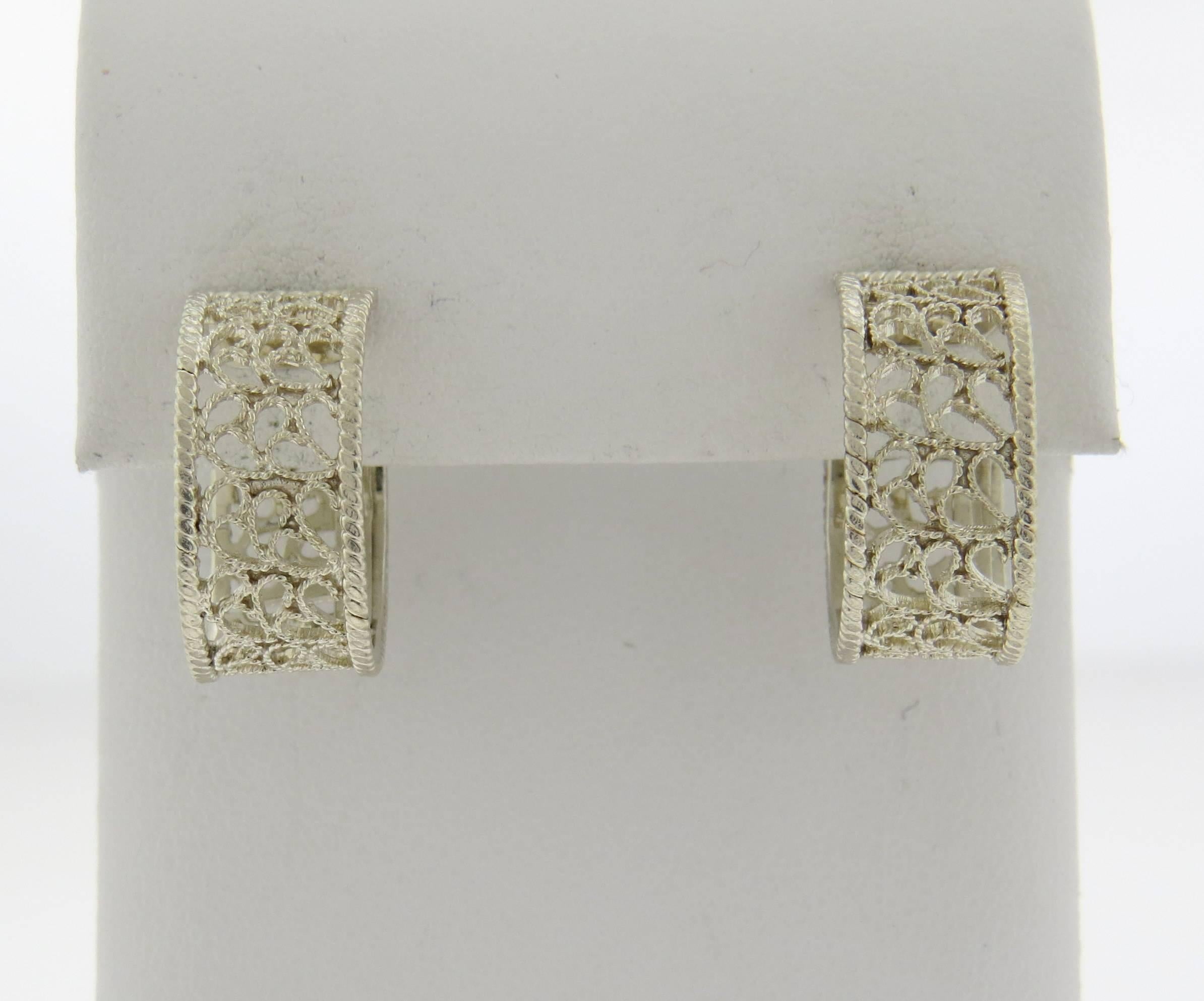 A pair of Silver hoop earrings by Buccellati.  The earrings measure 18.8mm x 9mm and weigh 5.1 grams.  Marked: Buccellati Italy 925.  Come with Buccellati paperwork.