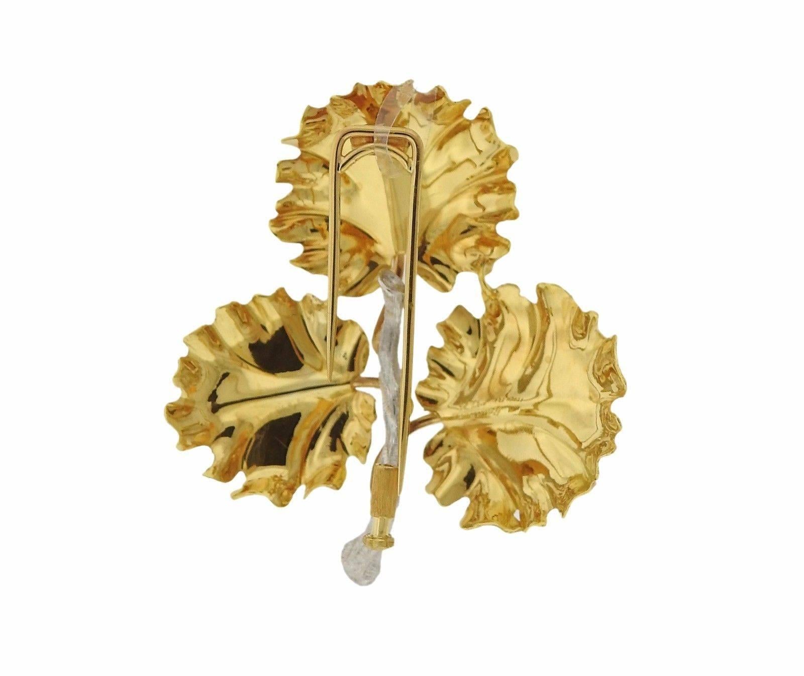 An 18K yellow, rose and white gold leaf motif brooch.  The brooch measures 46mm x 41mm.  The weight of the piece is 9.6 grams. Marked: 18K, Italy, Buccellati.  The brooch comes with box and Buccellati paperwork.  Retail is $9120.