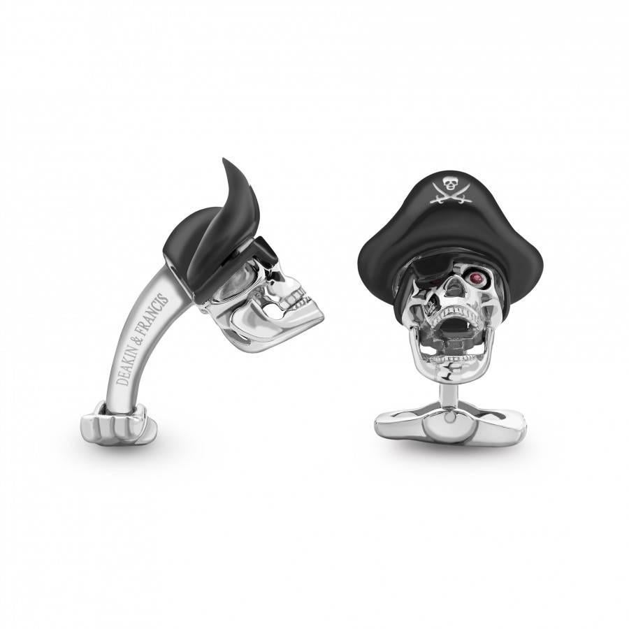 Brand new pair of Deakin & Francis sterling silver skull pirate cufflinks featuring ruby eyes. Cufflink tops measure 22mm x 20.6mm. Marked: Deakin & Francis, 925. Weight 22.1 grams. 

Come with box and papers