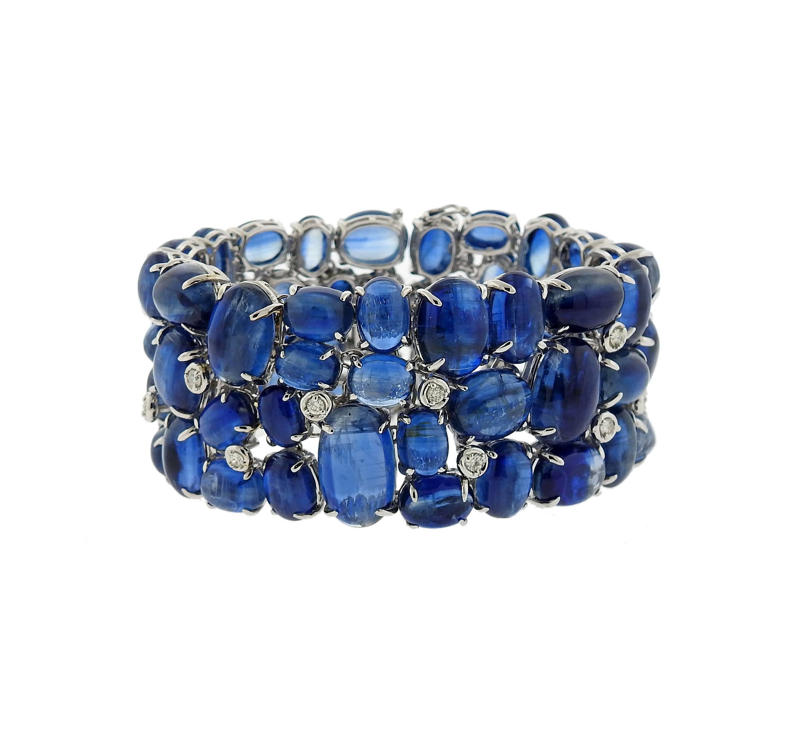 18k white gold bracelet, featuring kyanite cabochons,adorned with approximately 0.80ctw in diamonds. Bracelet is 6 7/8" long and 31mm wide . Marked: 750, 18k. Weight of the piece - 117.2 grams 