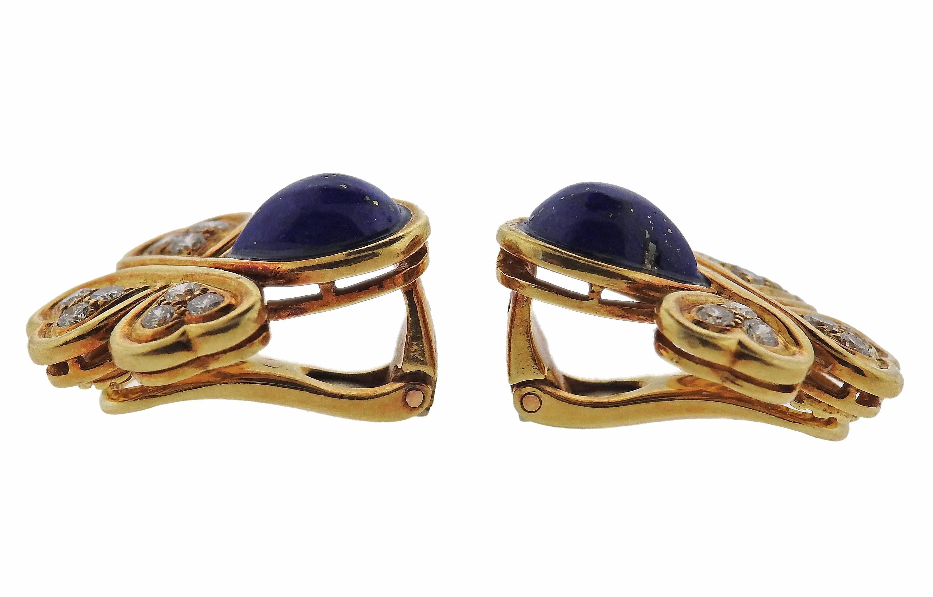 A pair of 18k gold diamond lapis earrings crafted by Dior featuring lapis stones and approximately 0.36ctw in G/VS diamonds. Earrings measure 20mm X 17mm. Weight is 10 grams.
