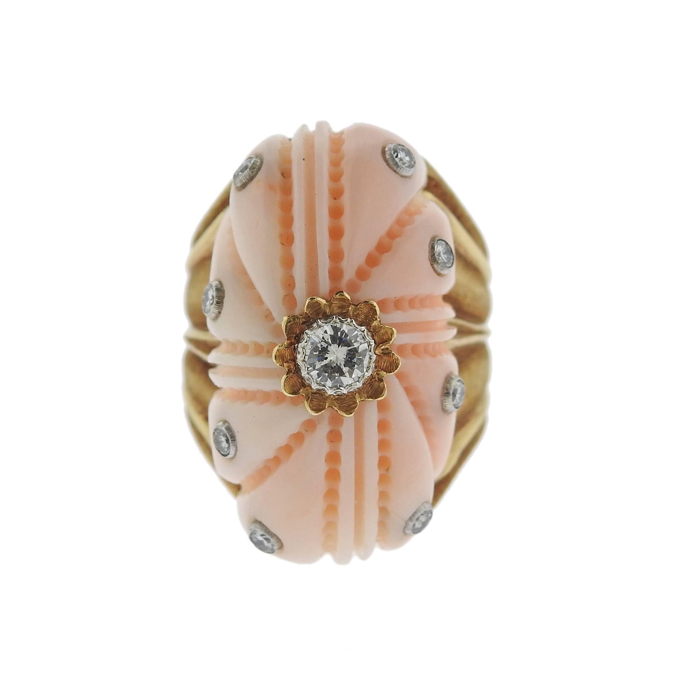 Beautiful 18k yellow gold ring, crafted by Buccellati, decorated with carved coral and approximately 0.40ctw in diamonds. Ring size 7, ring top is 28mm wide. Marked: Buccellati, Italy, 18k. Weight of the piece - 21.5 grams. 