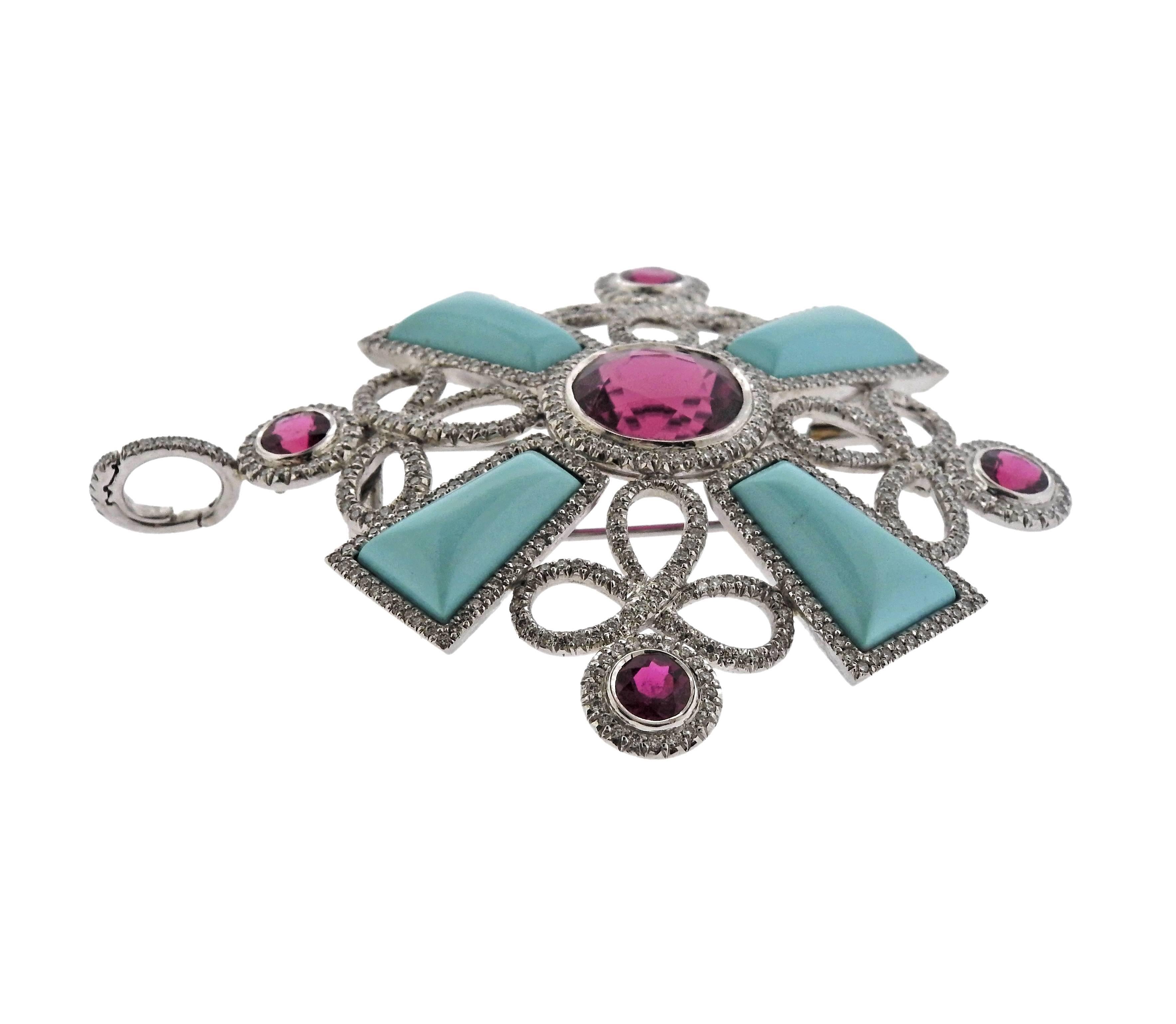 Large 18k white gold cross pendant/brooch, crafted by Haume, decorated with turquoise, pink tourmalines and approximately 1.80ctw in diamonds. Pendant measures 78mm x 65mm. Marked: 750, Haume. Weight of the piece - 47.1 grams. 