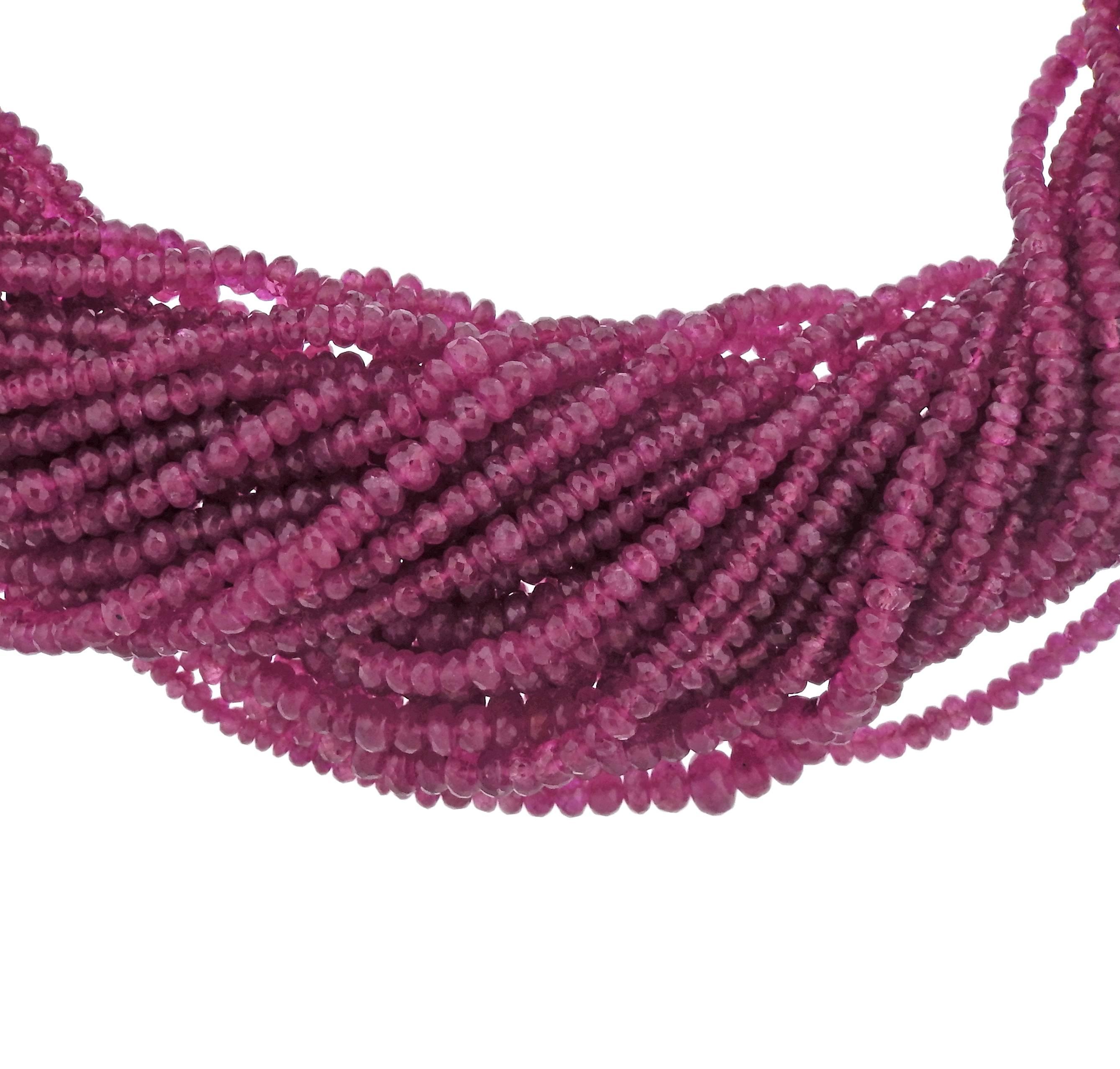 Impressive 18k gold torsade necklace, ceafted by Adria De Haume, featuring multi strands of pink sapphire  , approx. 1400carats !!  diamond decorated clasp. Necklace is approximately 16 1/2 inches long and 35mm wide.  Marked Haume and 750. Weight of