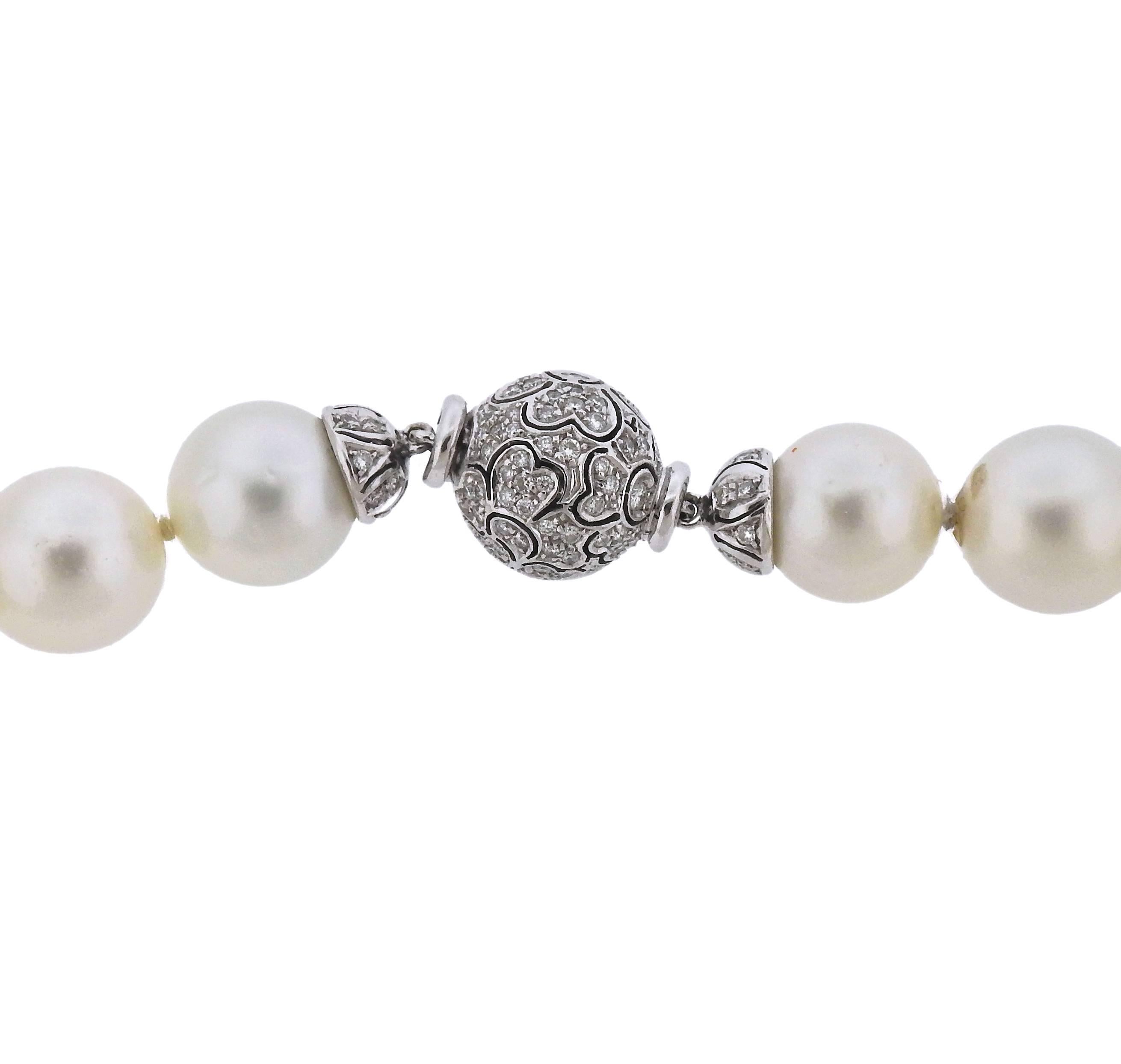 18k white gold necklace, decorated with approximately 0.60ctw in diamonds, featuring graduated South Sea pearls, measuring from 12.5mm to 16.8mm. Necklace is 21 inches long. Marked 750 and Italian mark. Weight of the necklace - 145.2 grams.