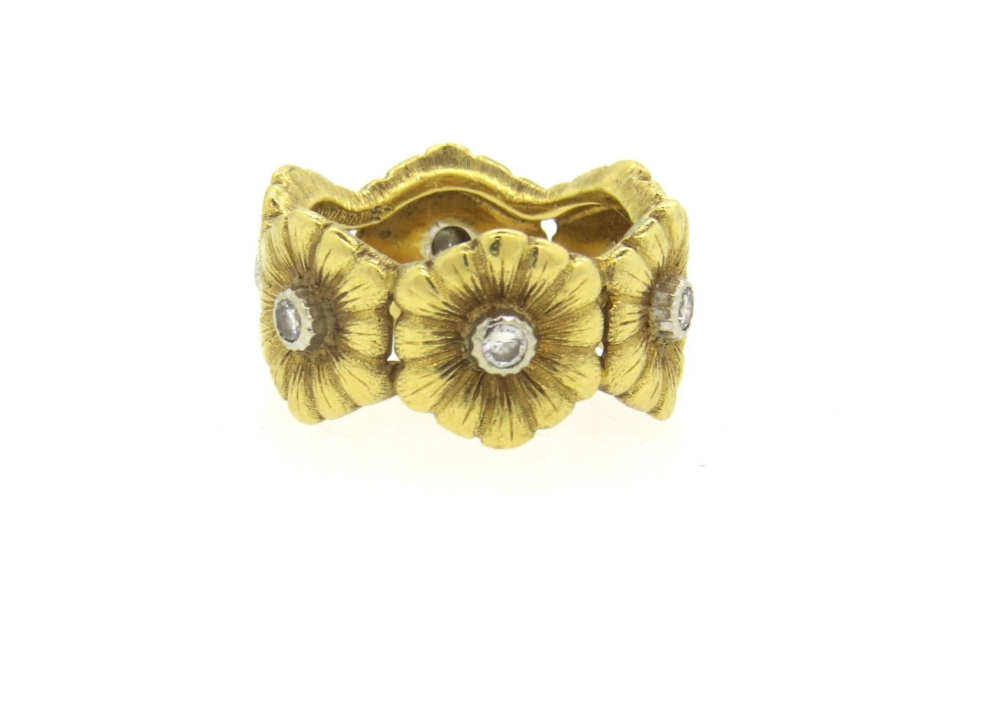 18k yellow gold band ring, crafted by Buccellati, featuring six flowers, each set with a diamond in the center. Ring is a size 4, ring is 10mm wide. Marked Buccellati, Italy. Weight of the piece - 7.7 grams
Comes with Buccellati box.