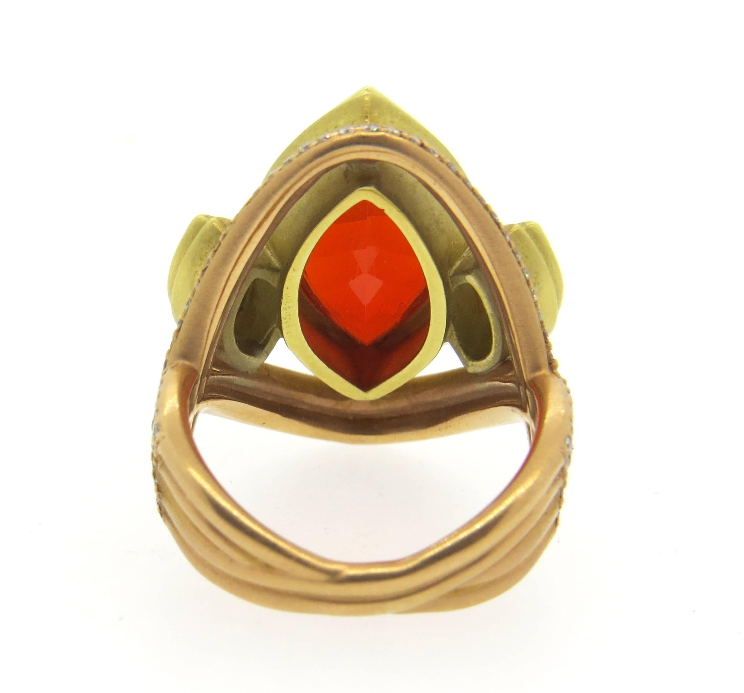 Impressive 18k yellow and rose gold ring, crafted by Sam Lehr, set with large  21.5mm x 11.5mm Mexican fire opal, surrounded with approximately 2.00ctw in G/VS diamonds. Ring is a size 8 1/2, ring top is 28mm x 23mm. Marked with Makers mark,750.
