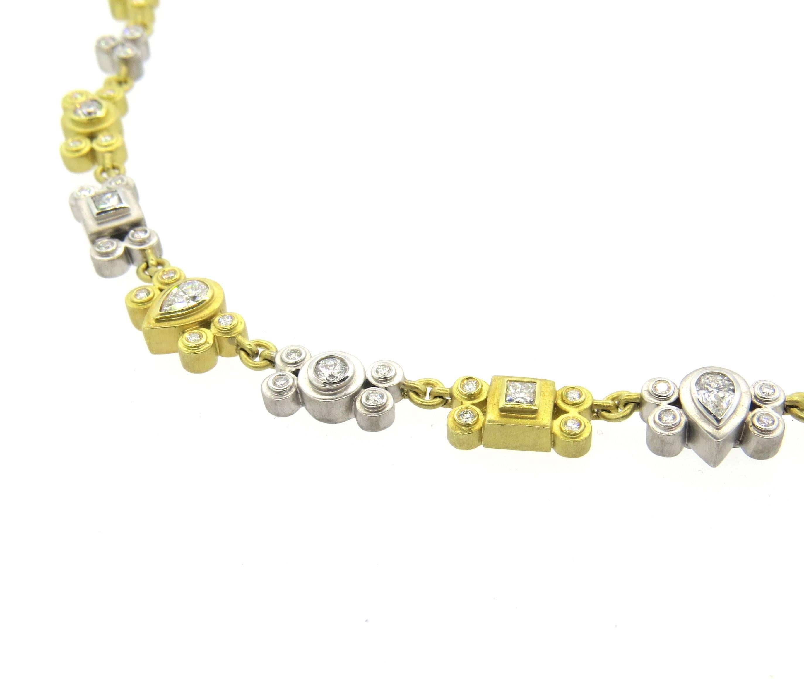 18k yellow and white gold necklace, crafted by Sam Lehr, decorated with approximately 3.30ctw in G/VS  round, square and pear diamonds. Necklace is 14