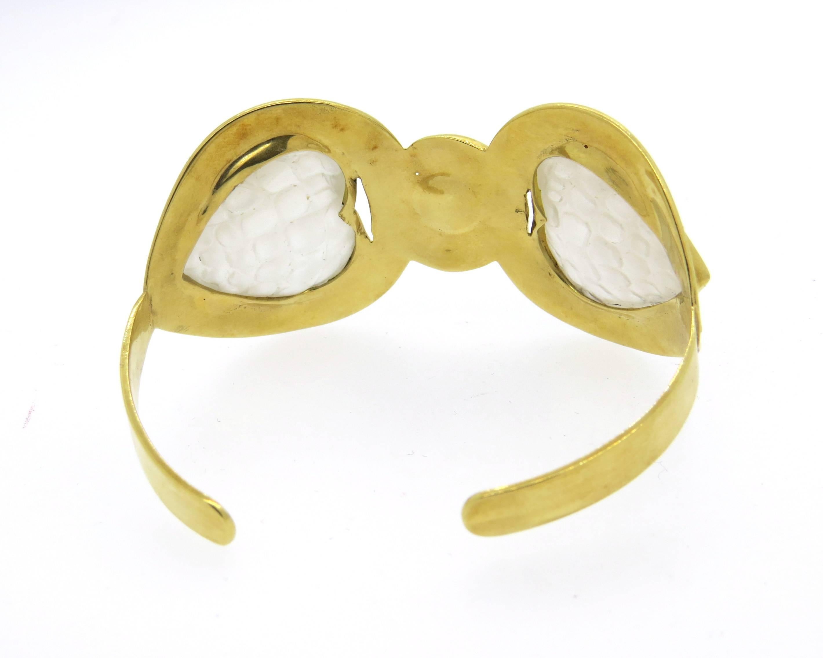 18k yellow gold cuff bracelet, decorated with frosted crystals. Bracelet will fit up to 7