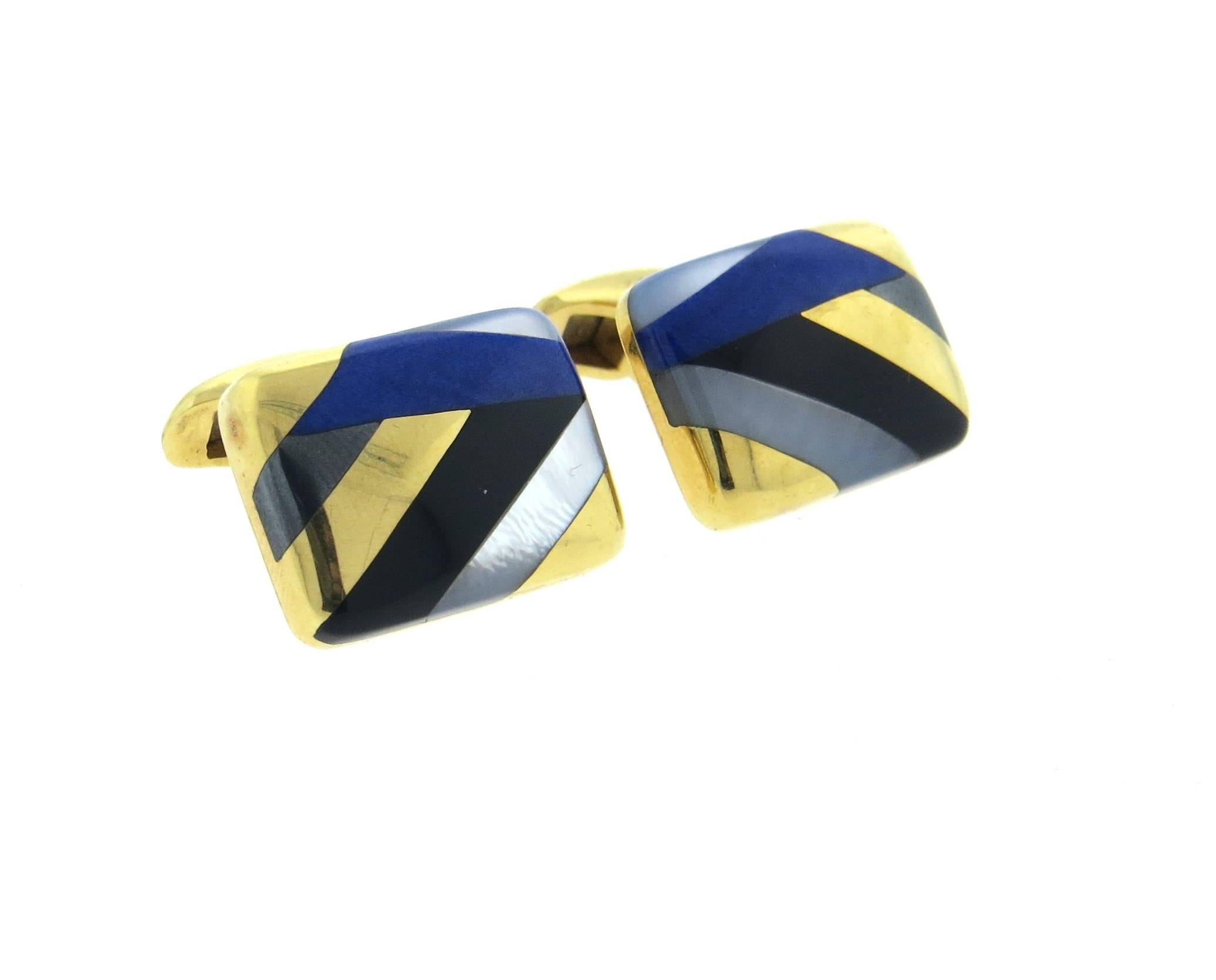 Large 18k yellow gold cufflinks, crafted by Asch Grossbardt, decorated with inlay mother of pearl, lapis lazuli and black onyx. Each top measures 21mm x 16mm. Marked AG 18k. Weight - 21.2 grams