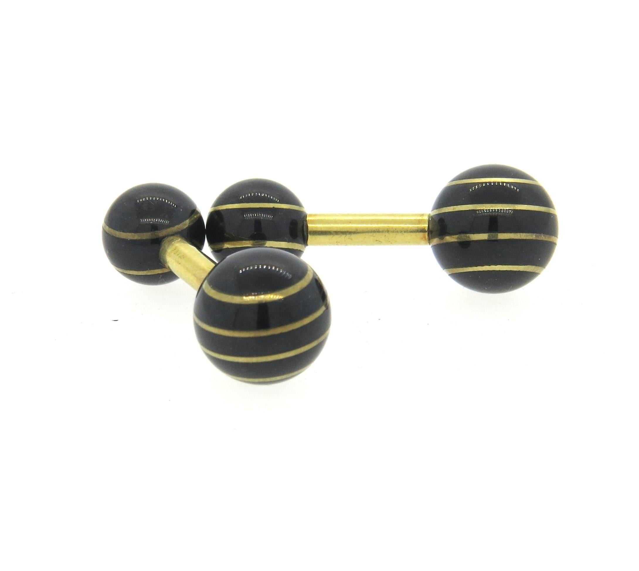 18k yellow gold dumbbell cufflinks, set with black jade stones. Top measures 11.5mm in diameter, back - 9.2mm in diameter. Weight - 10.1 grams