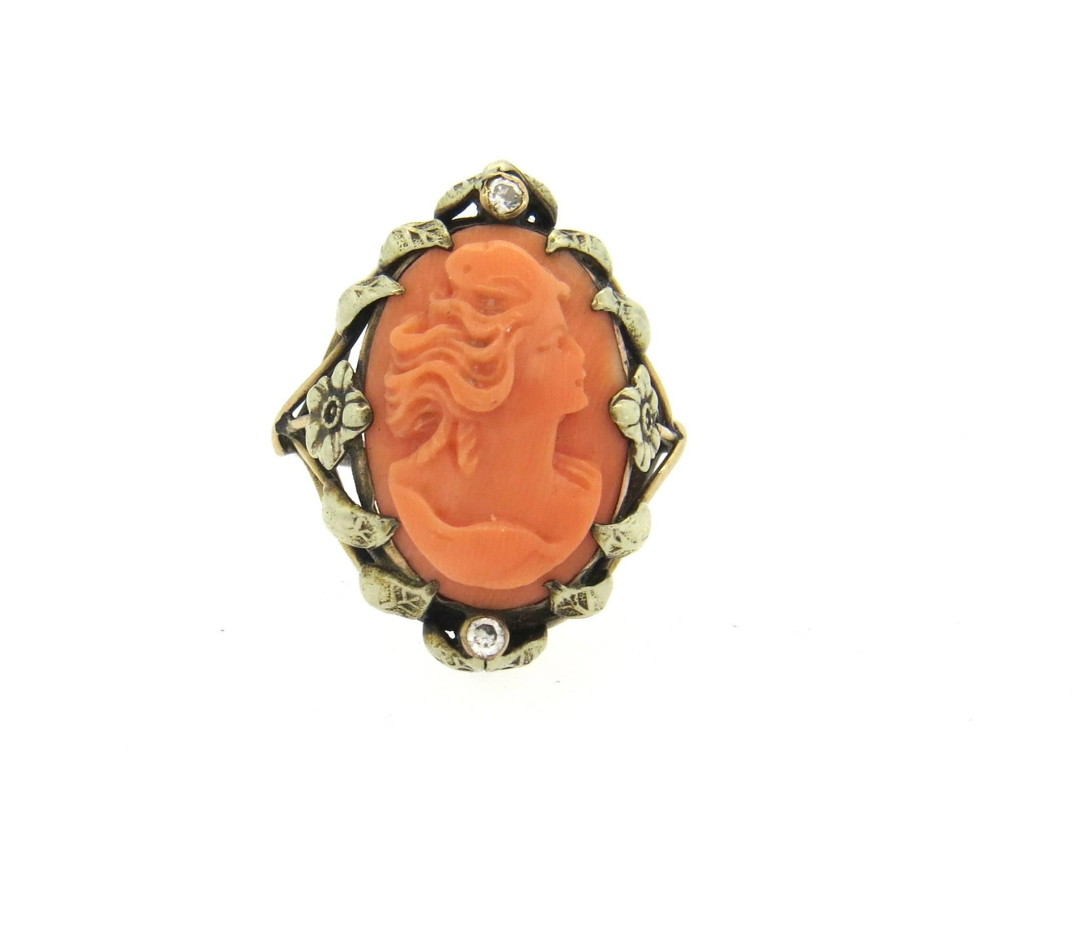 Antique 14k gold ring, set with 18mm x 12mm coral cameo as a centerpiece, surrounded with two diamonds. Ring is a size 5 1/2, ring top is 24mm x 18mm. Weight of the piece - 5.2 grams