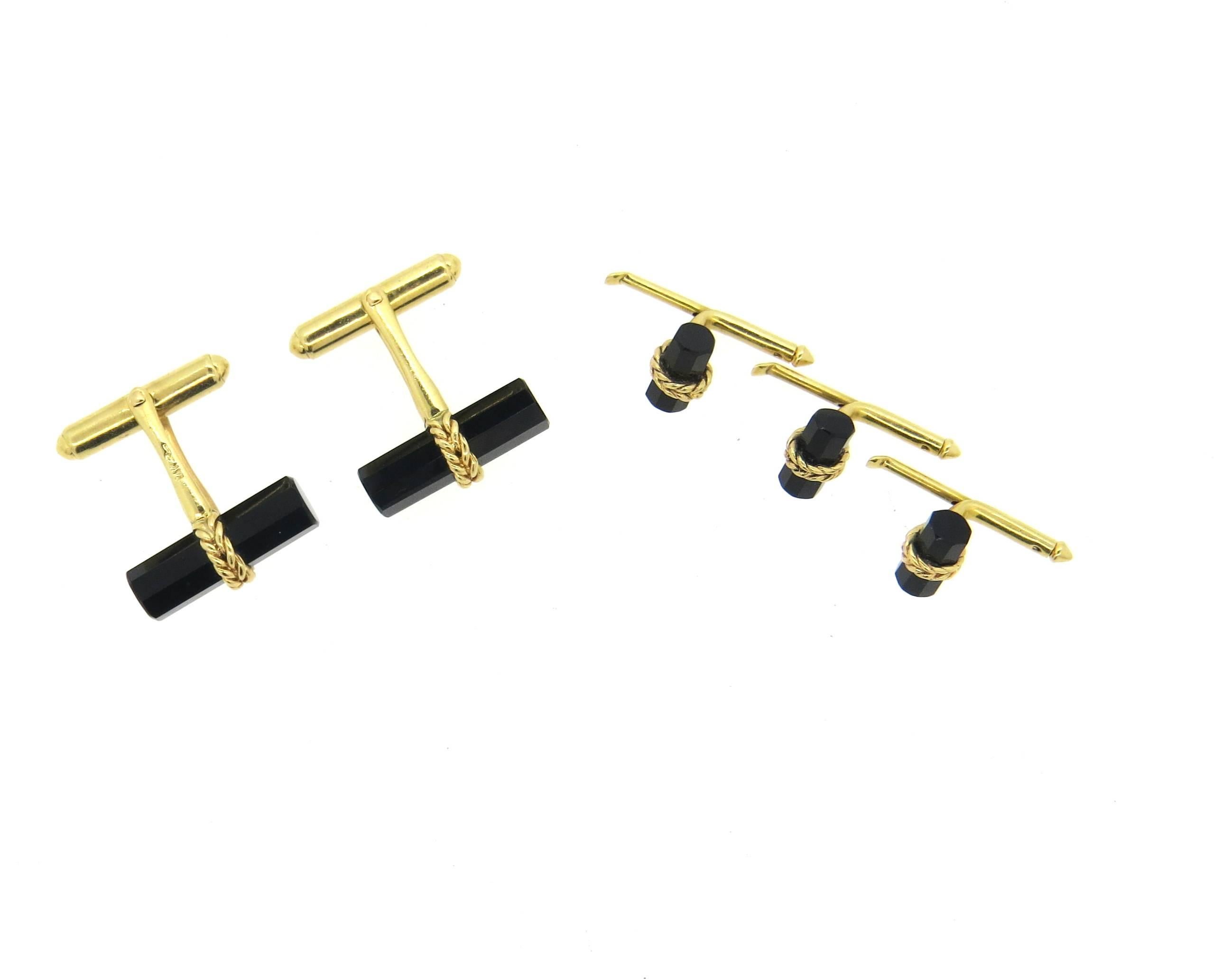 Vintage mid Century 14k yellow gold dress set, crafted by Larter & Son, including a par of cufflinks and three shirt studs, all decorated with faceted onyx top. Cufflink measures 20mm x 9mm, stud - 10mm x 6mm.Marked with maker's mark and 14k. 