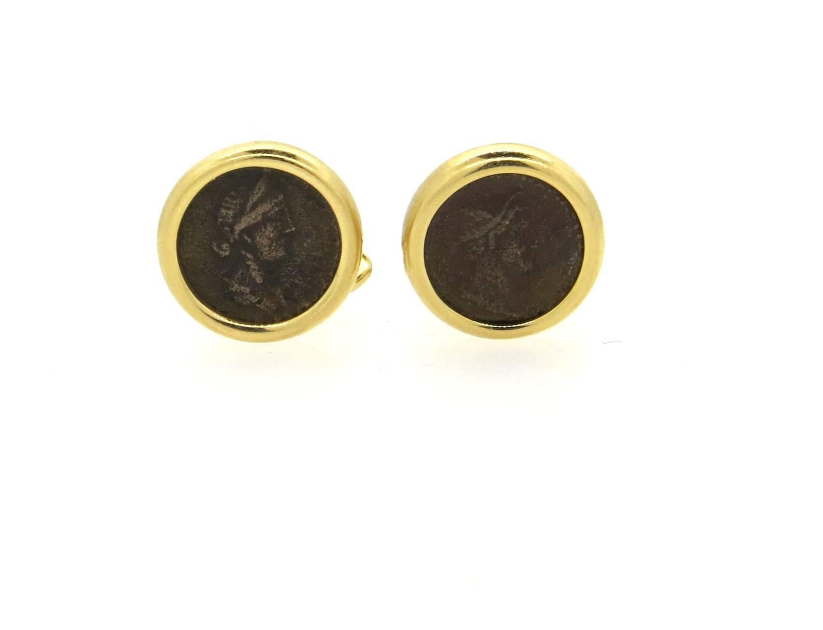 18k yellow gold cufflinks, crafted by Bulgari, set with ancient coins in the center. Cufflink top measures 16mm in diameter. Marked: Bvlgari, 750, made in Italy, Roma-Domitianus, Aug. A.D. 81-96. Weight - 21.5 grams