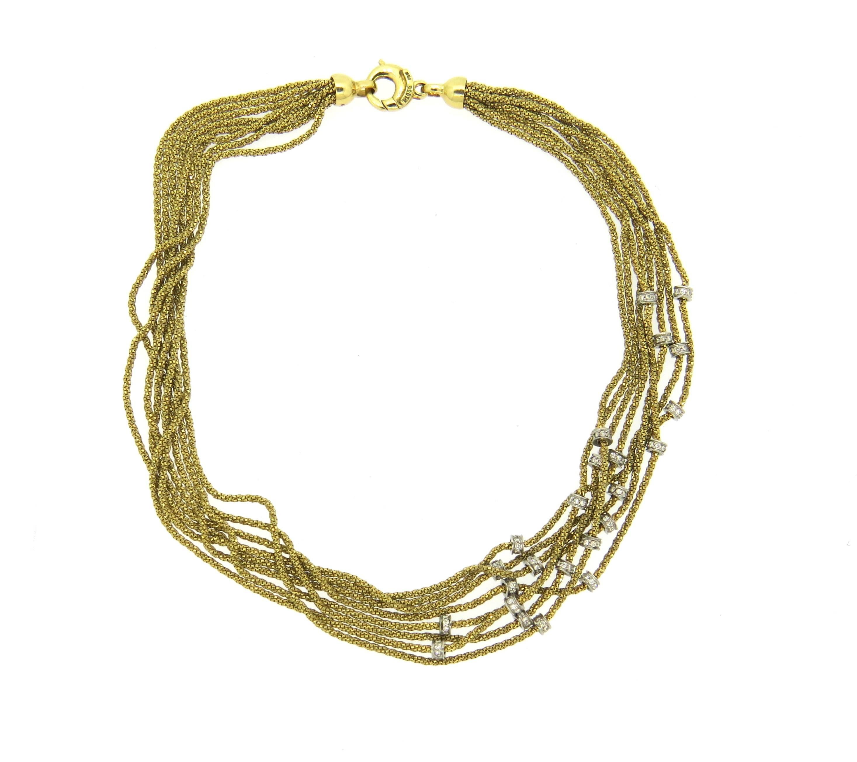 18k yellow gold and platinum multi chain necklace, decorated with approx. 1.50ctw in G/VS diamonds. Necklace is 14 1/8
