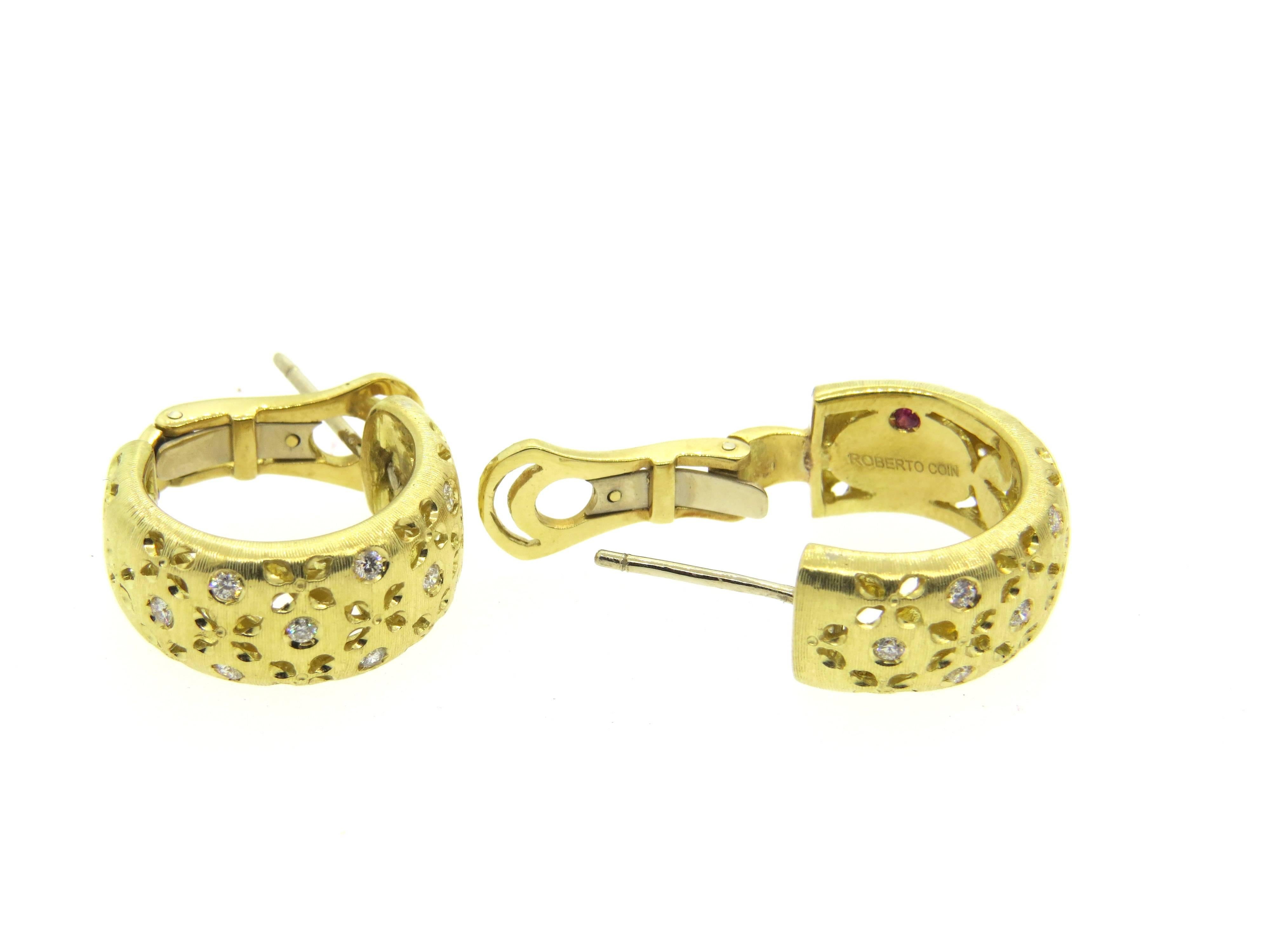 18k yellow gold hoop earrings, crafted by Roberto Coin for Granada collection, featuring approximately 0.50ctw in G/VS diamonds. Earrings are 22mm in diameter x 10mm wide. Marked Roberto Coin, with signature ruby, 18Kt, Italy, 1226VI. Weight - 19.1