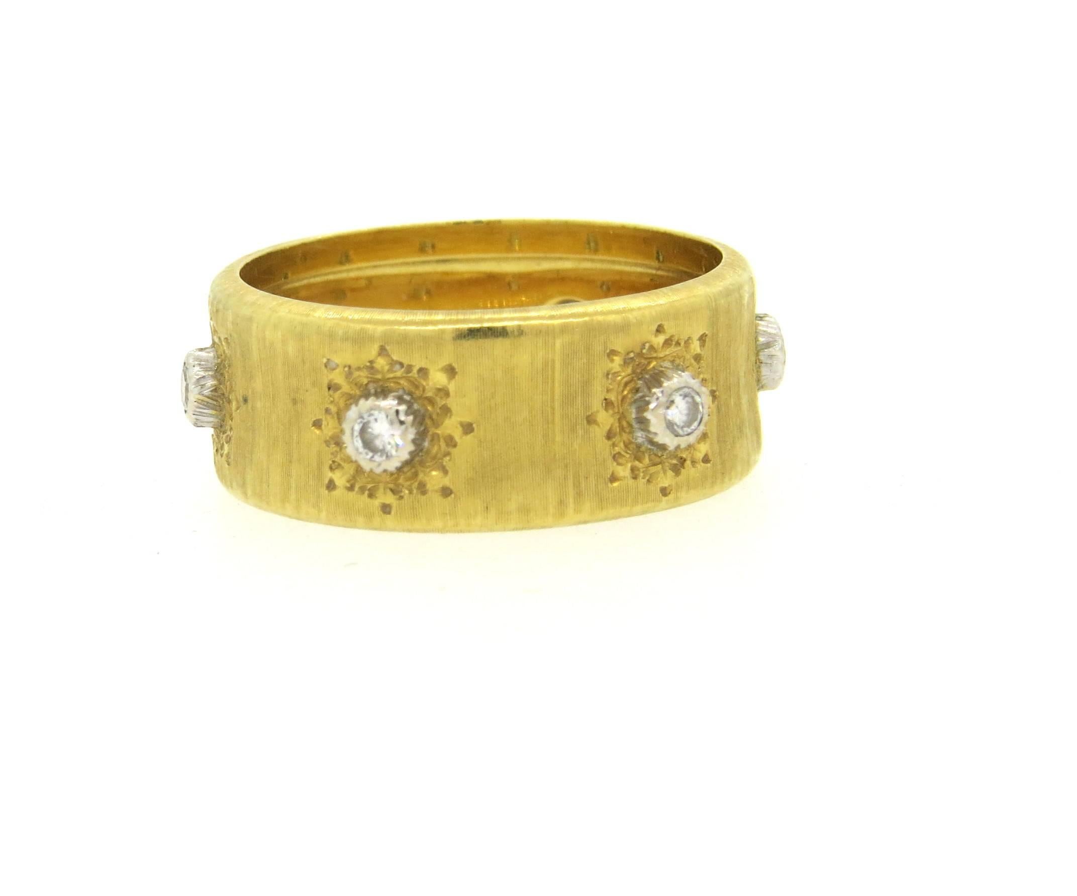 18k yellow gold band ring, crafted by Buccellati, set with six diamonds of approx. 0.18ctw GH/VS. Ring is a size 8, and is 8.4mm wide. Marked Buccellati 18k. Weight of the piece - 6.7 grams