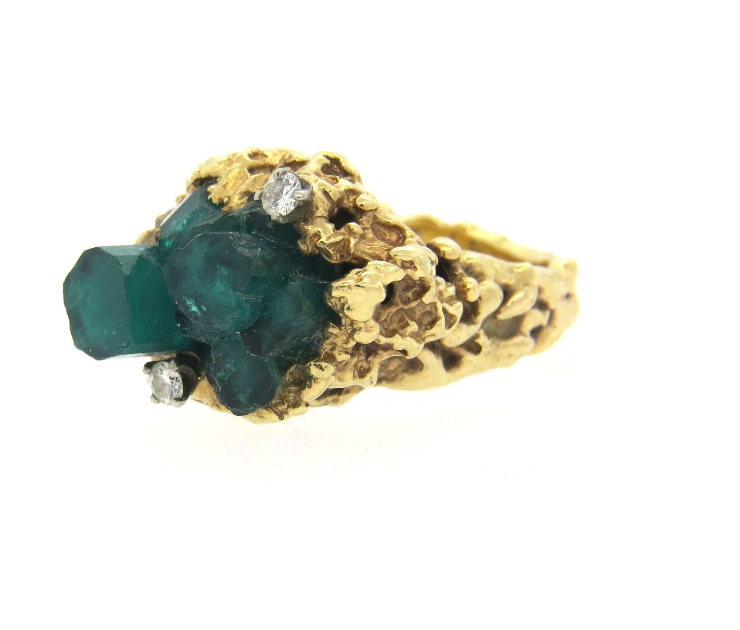 Vintage 14k yellow gold free form ring, set with Chatham emeralds and approximately 0.12ctw in diamonds. Ring is a size 5 3/4, ring top 15mm x 21mm. Marked 14k. Weight of the piece - 14.2 grams