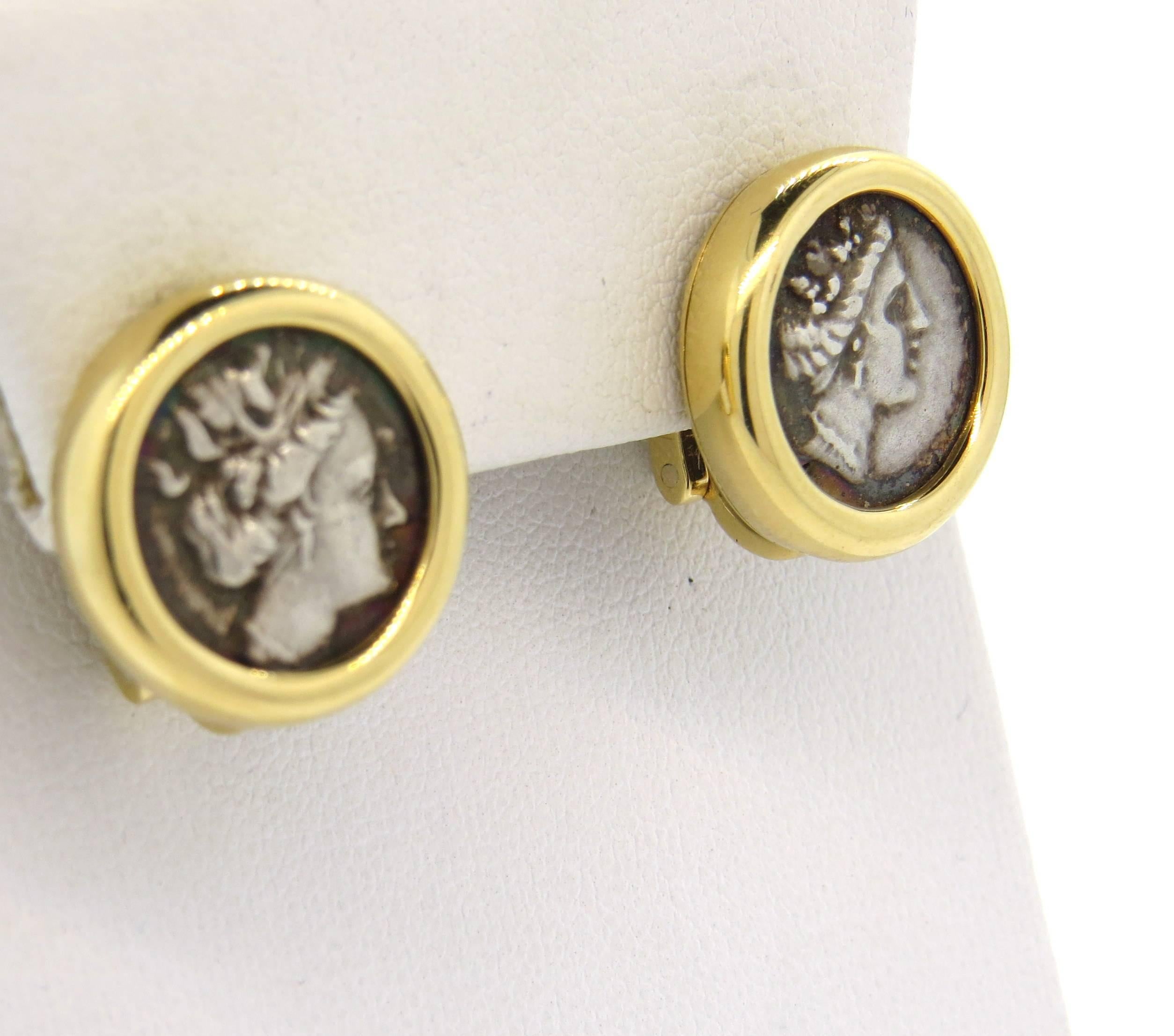 18k yellow gold earrings, crafted by Bulgari for Monete collection, set with ancient coins in the center. Earrings measure 17mm in diameter. Marked Bvlgari, AT6E66,made in Italy, 750, Euboea - Histiaia, 1nd cent. B.C. Weight - 18.3 grams 