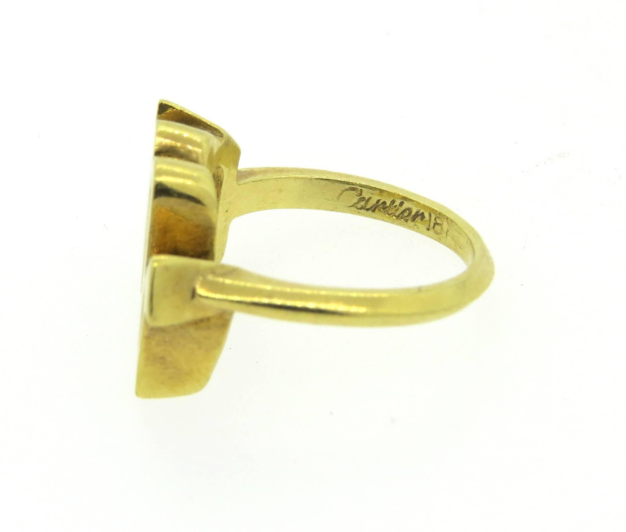 18k yellow gold ring, crafted by Cartier, featuring Scorpio zodiac sign. Ring is a size 3 1/2, ring top is 14mm x 15mm. Marked Cartier, 18k. Weight of the piece - 5.8 grams 