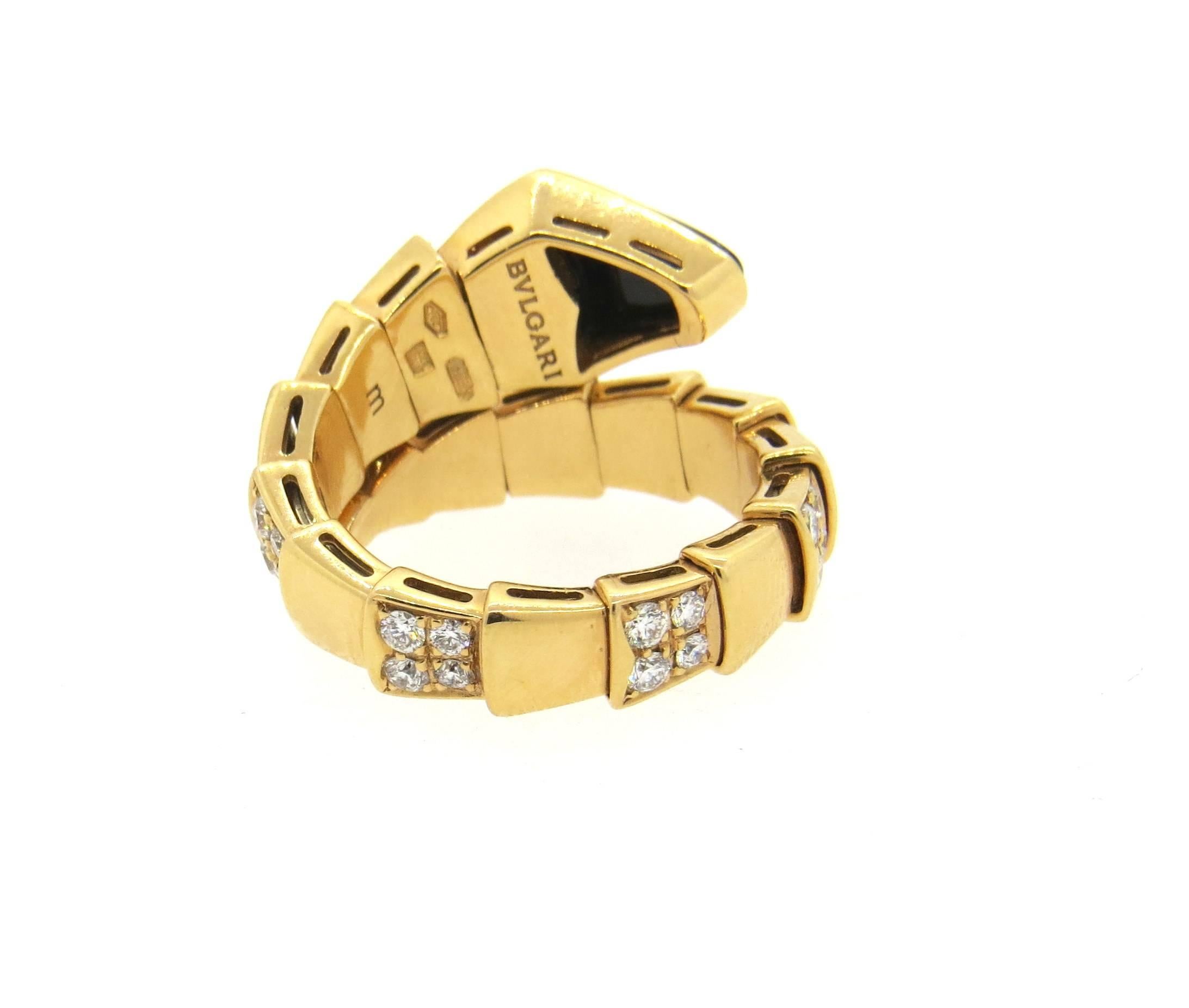 New 18k rose gold wrap ring, crafted by Bulgari for Serpenti collection, set with onyx and approximately 1.50ctw in G/VS diamonds. Ring is a size 6 1/2 - 7 (slightly flexible) . Ring top is 14mm wide. Marked : Bvlgari, m, 750, Italian gold marks.