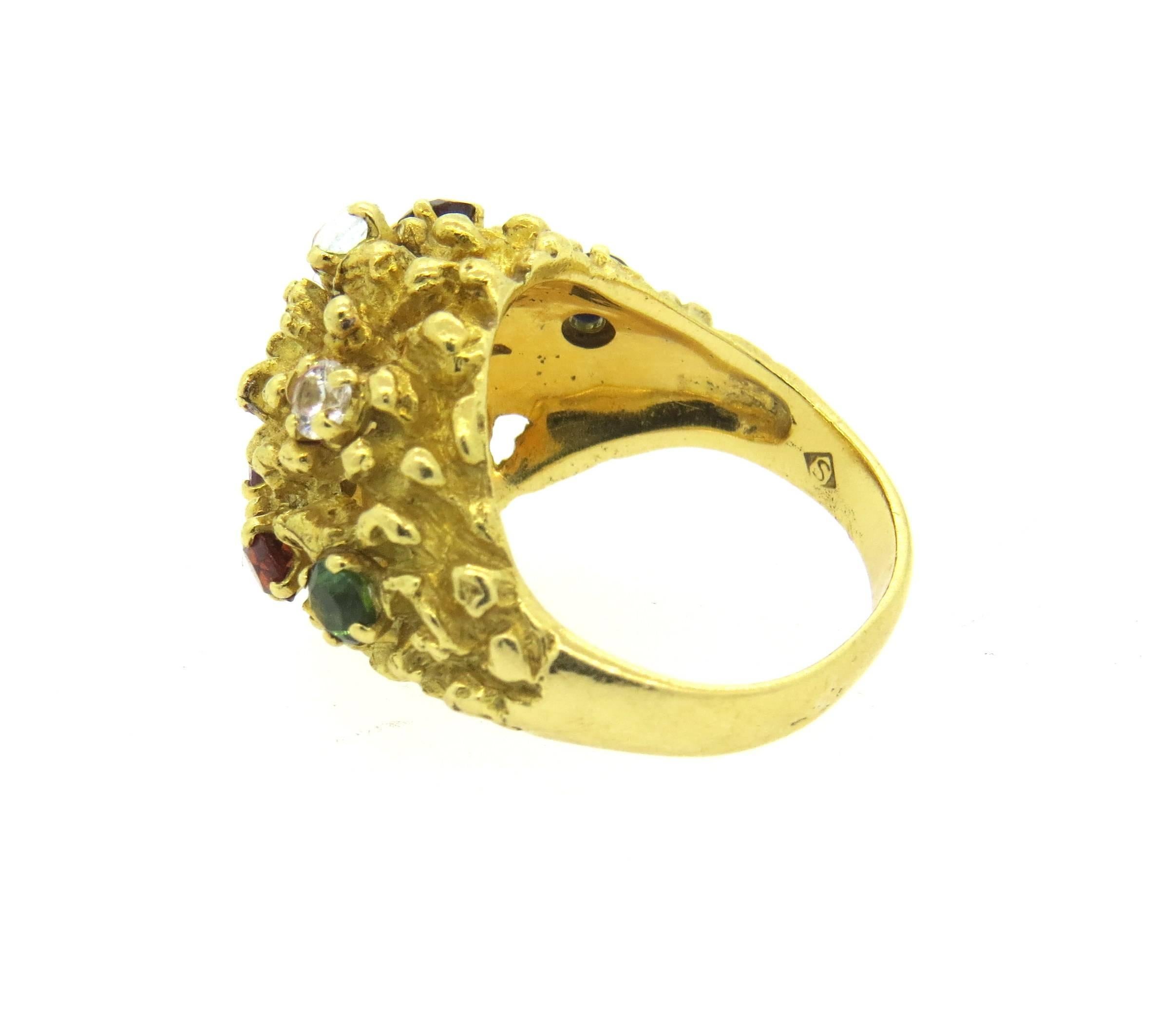 Vintage circa 1970s 18k yellow gold ring, crafted by H Stern, decorated with multicolor gemstones on free form top. Ring is a size 7 1/2, ring top is 18mm wide. Marked: S mark, 750. Weight of the piece - 13 grams 