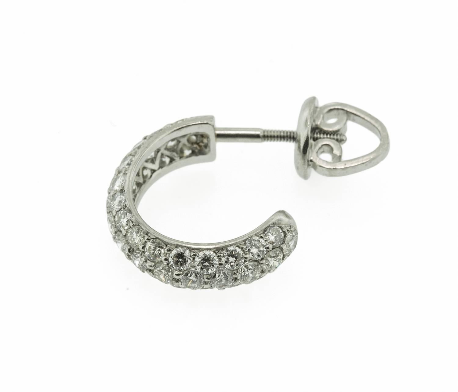 These 18kt white gold huggies are exceptionally well made. They are encrusted with eighty six, round brilliant cut diamonds. The diamonds are bead set and weigh 2 cts, E-F-G colour, VS-SI clarity. The earrings show as a blazing circle of diamonds