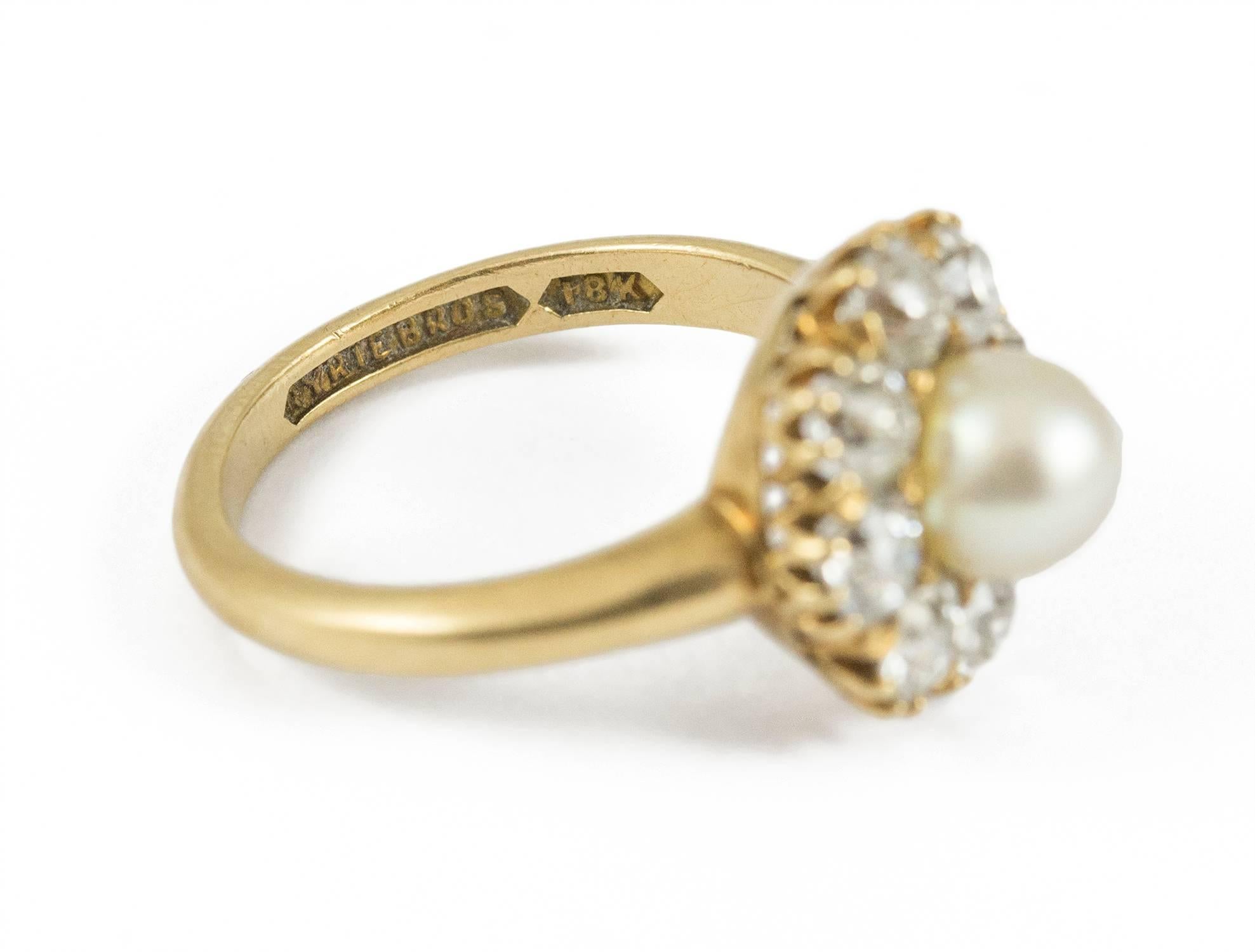 This antique ring was made circa 1905. It is set in 18kt yellow gold and clearly stamped with makers mark and gold carat. The natural pearl is off round and 6.5 to 7mm and is a creamy white colour. It is surrounded by 8 old European cut diamonds