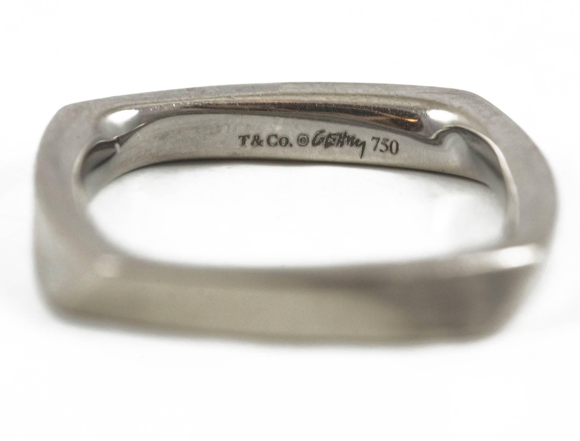 A beautiful Frank Geary designed ring for Tiffany set in 18k black gold. This is a classic from the Torque collection. The ring measures size 6 and is in excellent condition.