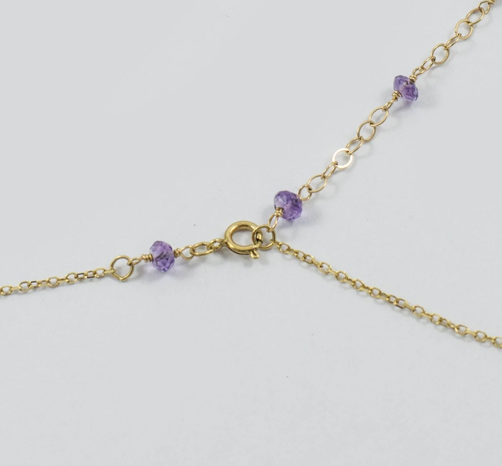 A delightful necklace set in 14k yellow gold. This dramatic necklace suspends bright briolette, pear and bead cut semi precious gemstones. The construction is excellent with much attention to detail as the necklace also has the ability to be