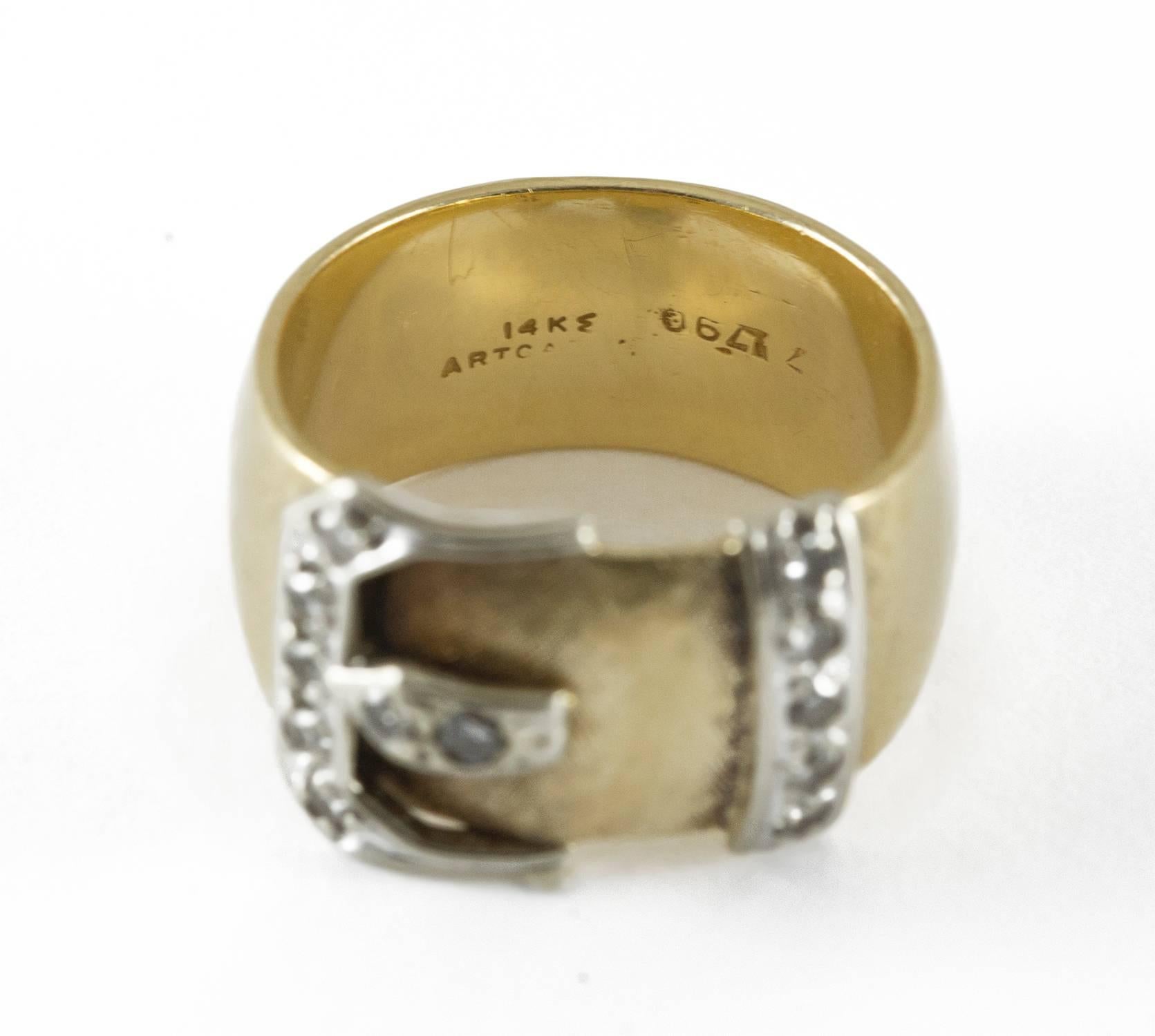 A high quality buckle ring set in 14k yellow gold with 12 single cut diamonds (.24 F-G, VVS-VS) enhancing the buckle detail set in white gold. This ring is custom made and very well executed. it was made circa 1910 and measures size 5.5 and is in