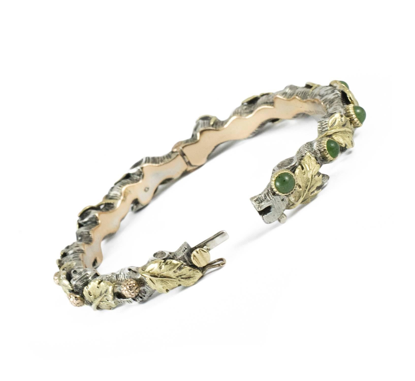 A significant bangle bracelet by Mario Buccellati in yellow gold, rose gold, silver and chalcedony. The bracelet is an example of extraordinary hand crafted workmanship of oak leaves and acorns in gold with the addition of chalcedony detail on a