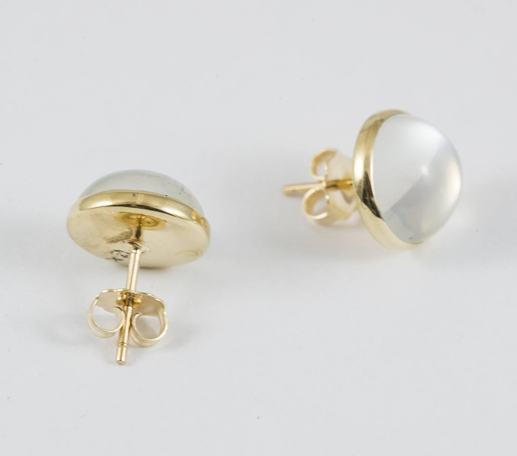 A luminous pair of vintage cabochon moonstone earrings set in 14K yellow gold. These earrings are in excellent condition.
