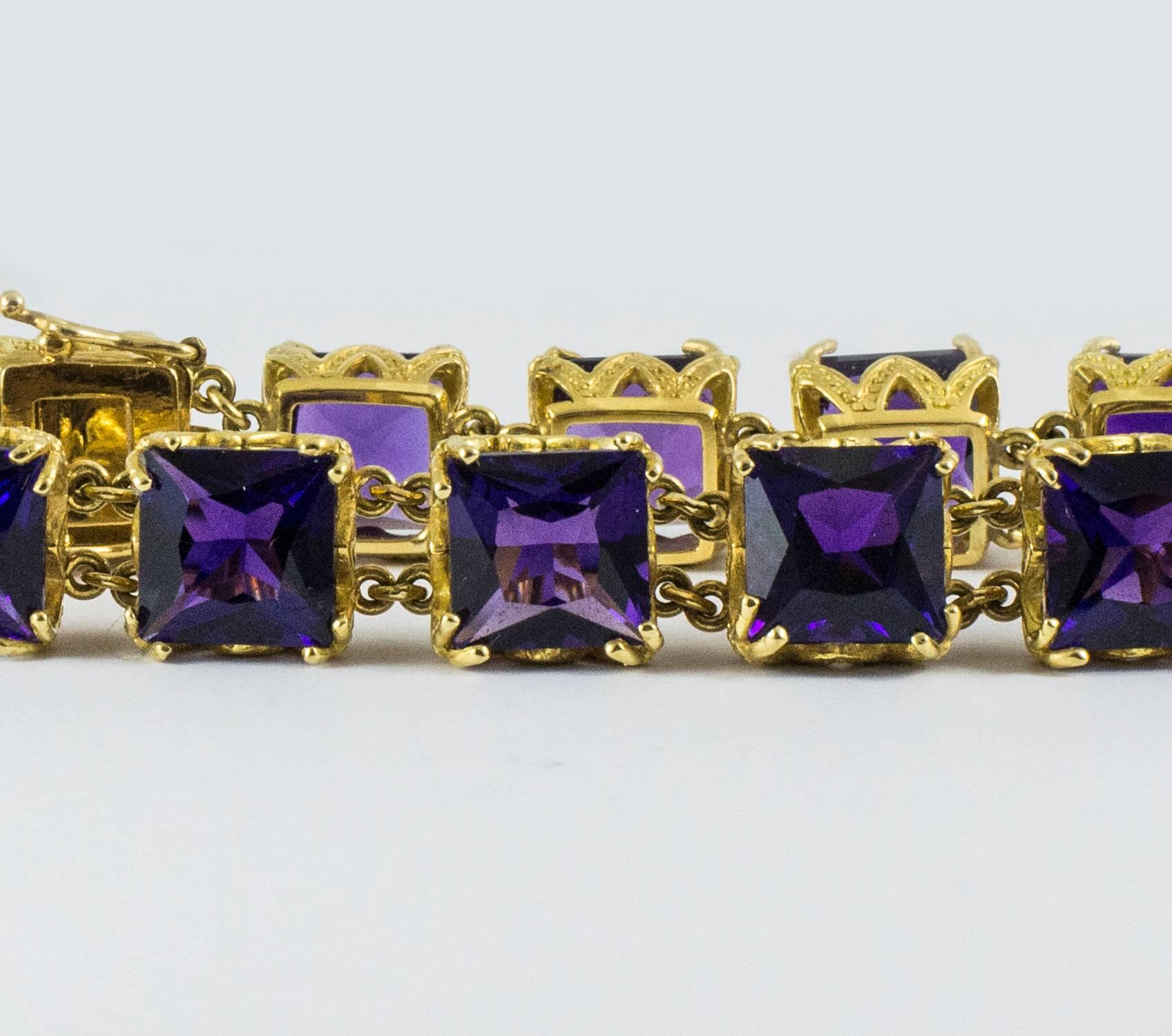 An exceptional amethyst bracelet set in 18k custom made gold box mount. The bracelet holds 12 square mixed cut amethysts totaling 52.5 ct. tw. The amethysts are a deep strong and transparent purple. This colour is typical of the highest quality