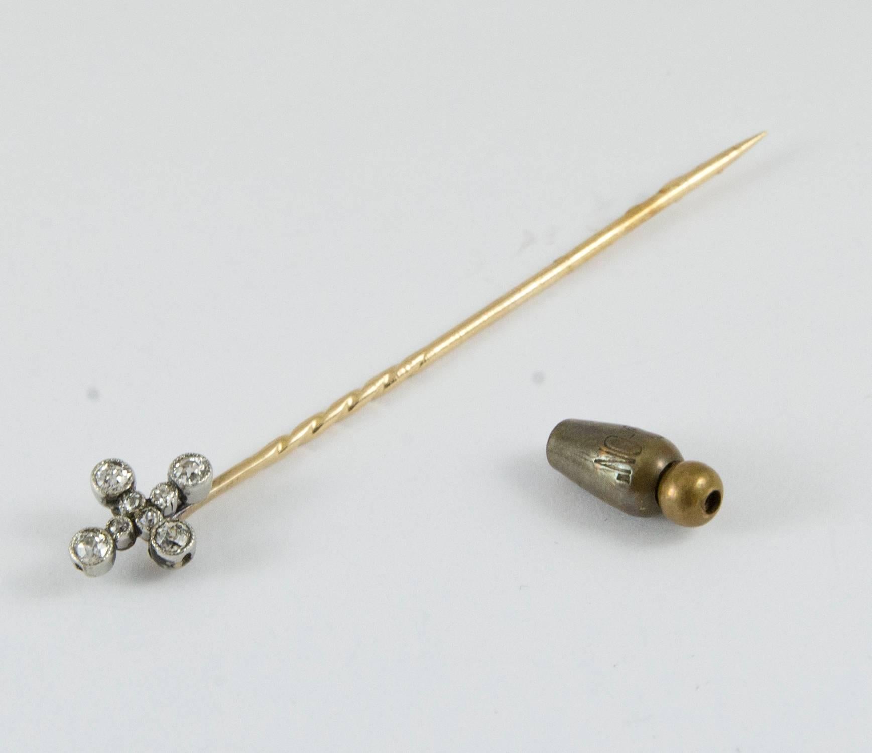 A delightful stick pin made Circa 1915. This stick pin holds eight old European cut diamonds weighing .38 ct. (G-H, SI-I).
The pin itself is 14k yellow gold and the diamonds are set in platinum. It measures 2.5 inches long and has the original