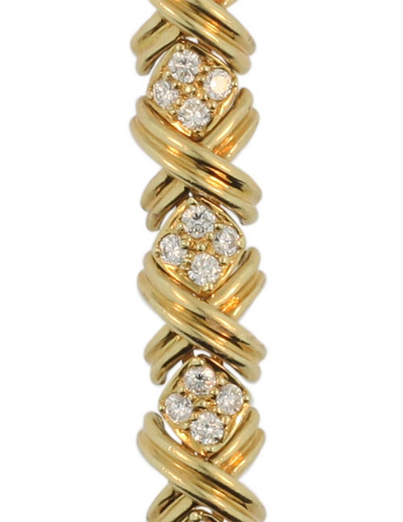 A beautiful diamond and gold line bracelet designed by Jean Schlumberger for Tiffany&Co. It holds 3cts of high quality round brilliant cut diamonds. E-F color, VVS clarity. The bracelet measures 7 inches and is finished by a buried safety clasp. It