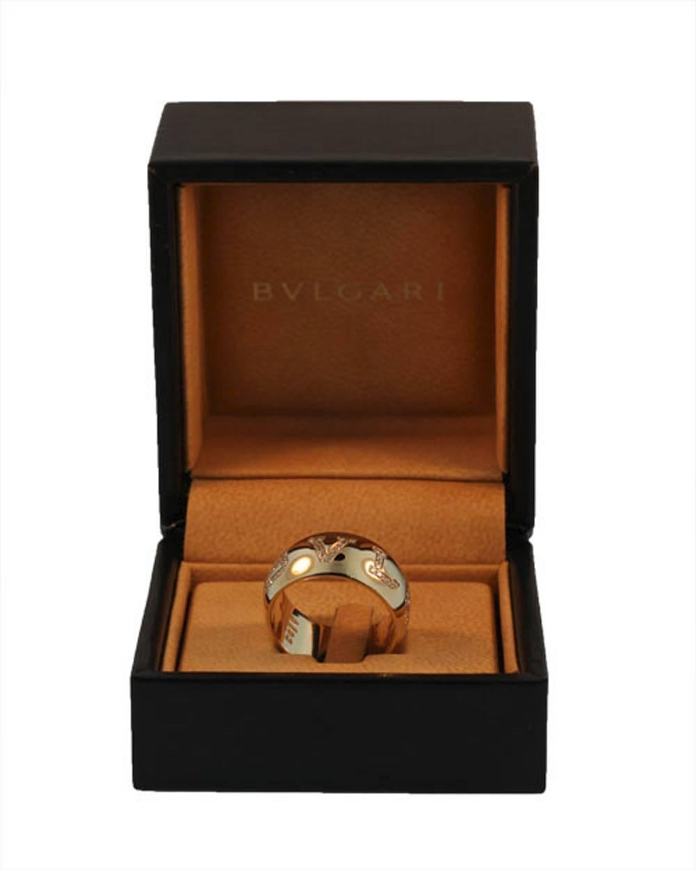 This beautifully executed Bvlgari ring is 18kt yellow gold. It is set with .50cts of fine high quality diamonds EF-VS. The Bvlgari signature is sculpted around the ring and the diamonds are embedded in each letter. This ring comes with its original