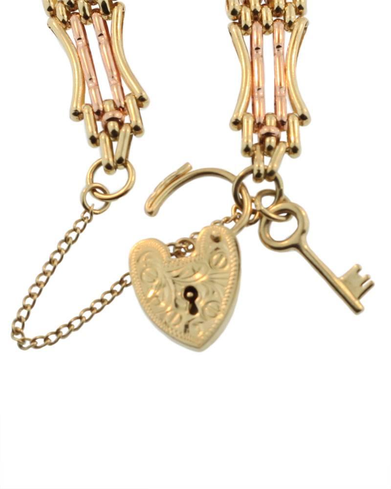 This gate bracelet has an intricate link in yellow and rose gold. It is clearly stamped 585 (15K). The bracelet was made in England circa 1905 (Edwardian). It is finished with a hand engraved heart lock and also has the little key which is rare.The
