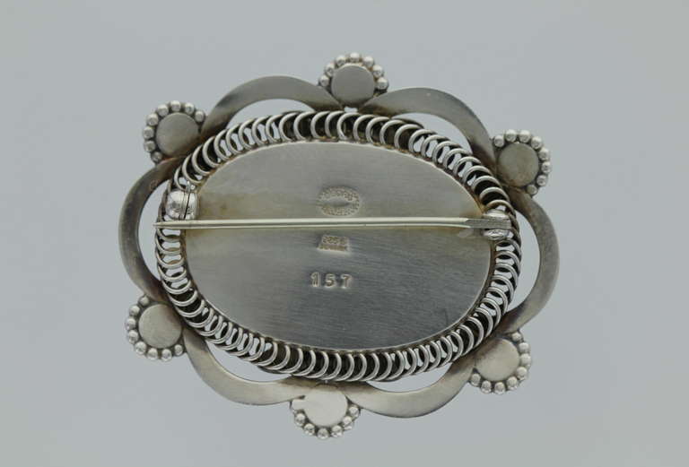 Georg Jensen Sterling Silver and Moonstone Brooch No. 157.   This brooch was designed by Georg Jensen in 1914.  The brooch measures 1 7/8
