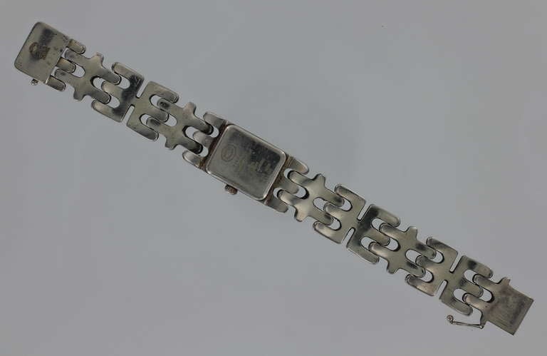 Georg Jensen sterling silver bracelet watch, No. 2376, designed by Edvard Kindt-Larsen. Rare and out of production. Has stamps for Georg Jensen, Denmark. With a rectangular white dial and bracelet of approximately 6 1/4 inches.