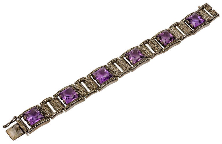 An amazing suite of Art Deco sterling silver, Marcasite, Amethyst jewelry including necklace, bracelet earrings and a ring  by Theodor Farhner.

The Necklace is approximately 17 inches long and 0.75 wide
The Bracelet is 7 inches long and 0.5