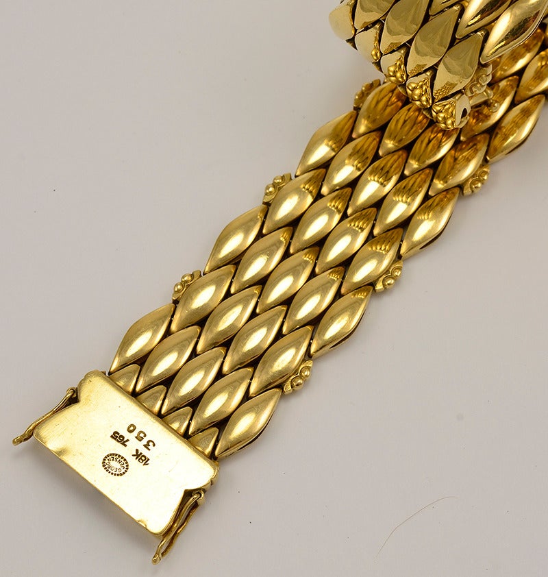 Georg Jensen 18kt Gold Bracelet No. 350.  This bracelet was designed by Harald Nielsen.  This bracelet measures 7.5 inches long and 0.875 inches wide.  Bracelet bears impressed company marks for Georg Jensen, Denmark, 18 karat. This bracelet is in