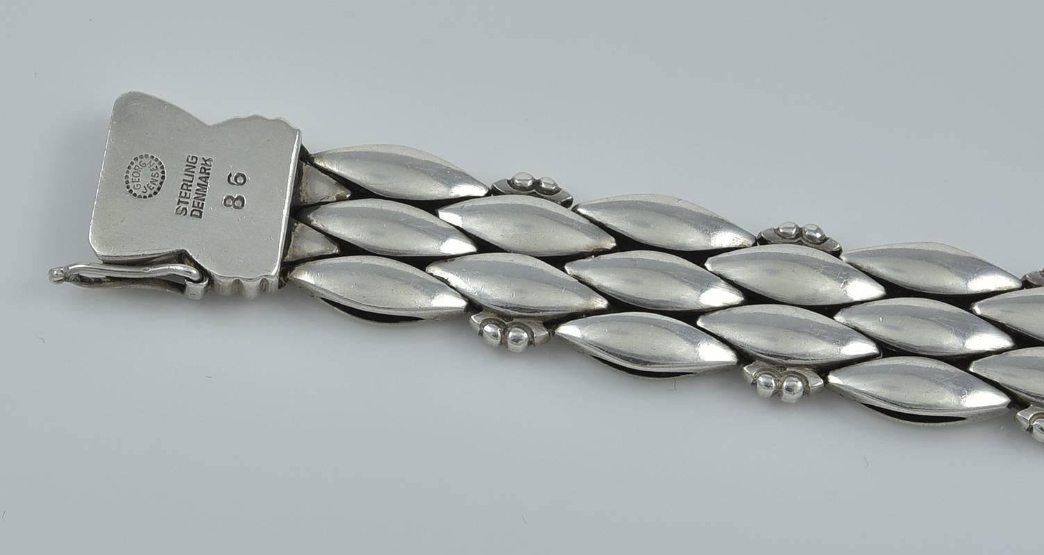 Georg Jensen Sterling Silver Bracelet No. 86.  The bracelet was designed by Harald Nielsen circa 1945.  The bracelet measures 7.375 inches long and 0.5 inches wide.  This bracelet bears impressed company marks for Georg Jensen, Sterling, Denmark, 86.