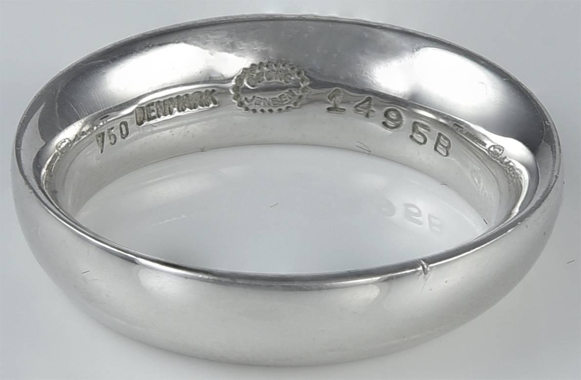 Georg Jensen White Gold Ring No. 1495B. This ring is a Danish Modern design in 18kt white gold and the ring is size 7.25. The ring bears impressed company marks for Georg Jensen, 750, Denmark, 1495B. This ring is in excellent condition.