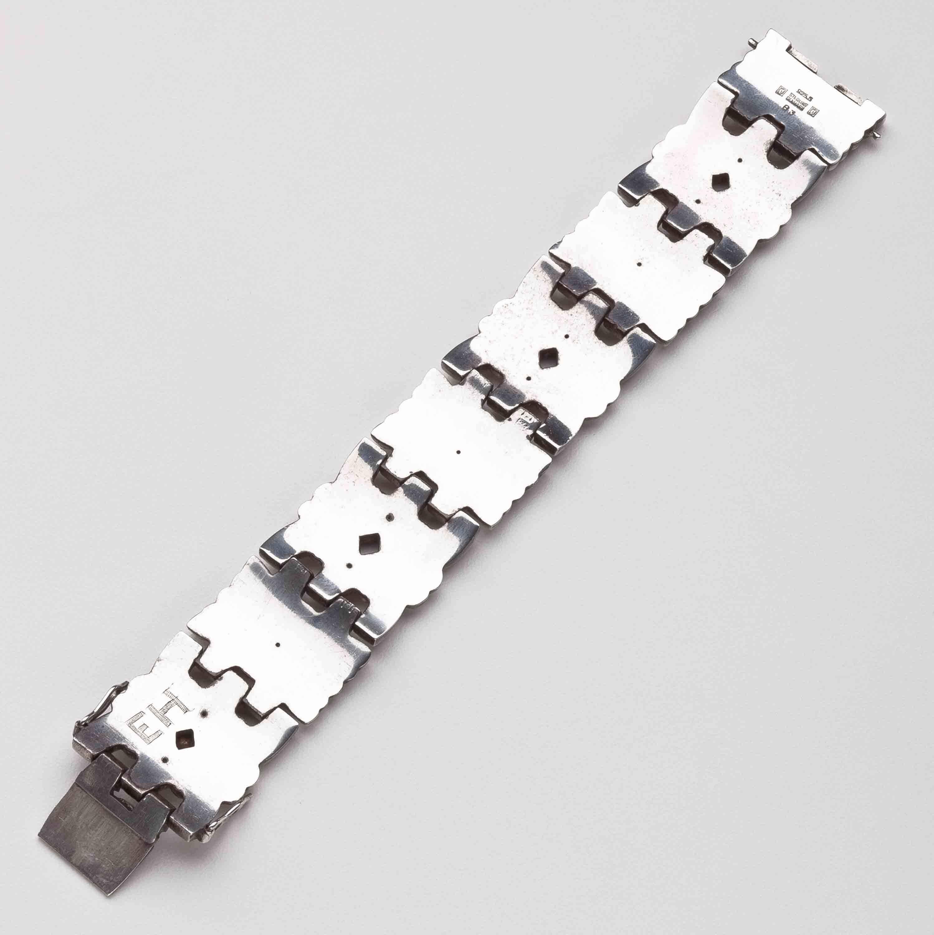 Georg Jensen Bracelet No. 83.  This bracelet  is a rare design by Harald Nielsen.  The bracelet measures 7.5 inches long and 1 inch wide.   The bracelet bears impressed company marks for Georg Jensen circa 1933-1944, Sterling, Denmark, 925S, 83. 