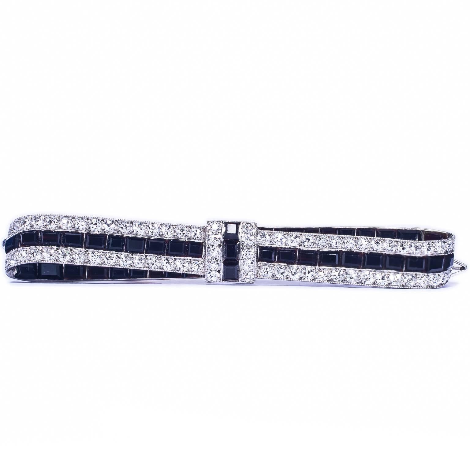 Cartier Early Art Deco Onyx Diamond Platinum Bow Brooch For Sale
