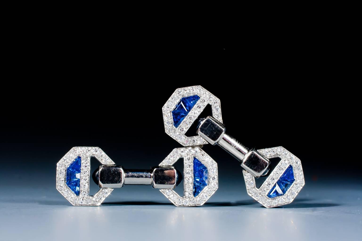 A rare and magnificent pair of Art Deco sapphire and diamond cufflinks by Cartier, designed as flexible octagonal panels, set with cabochon cut and calibré cut sapphires and round cut diamonds, mounted in platinum and gold.
Signed CARTIER and