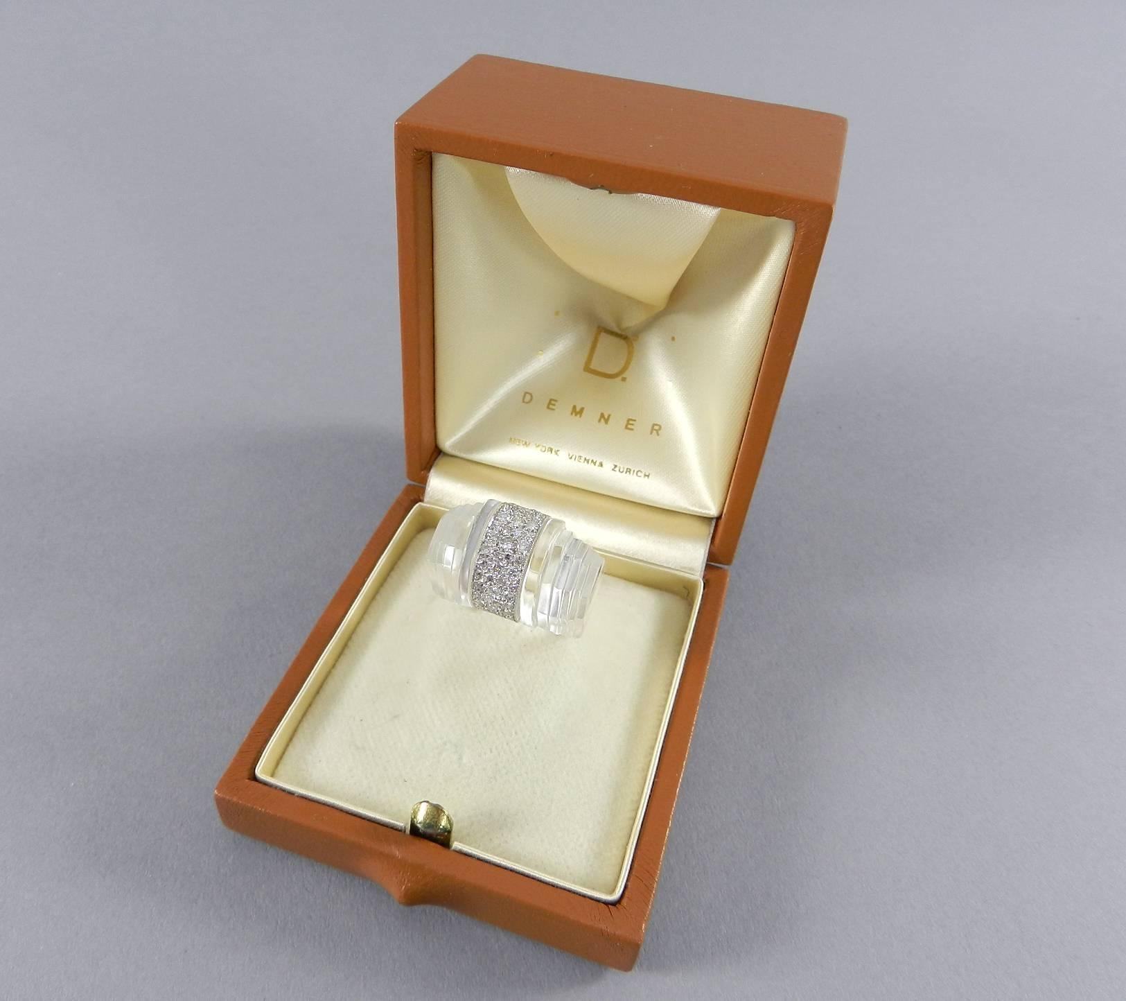 Demner clear rock crystal, diamond, and 18k white gold ring. Stepped Art Deco style design. With original box. Ring size 6.5. Approximately 1 carat total weight diamonds, VS clarity, G color.  Front face measures approximately 23 x 14 mm. 

We